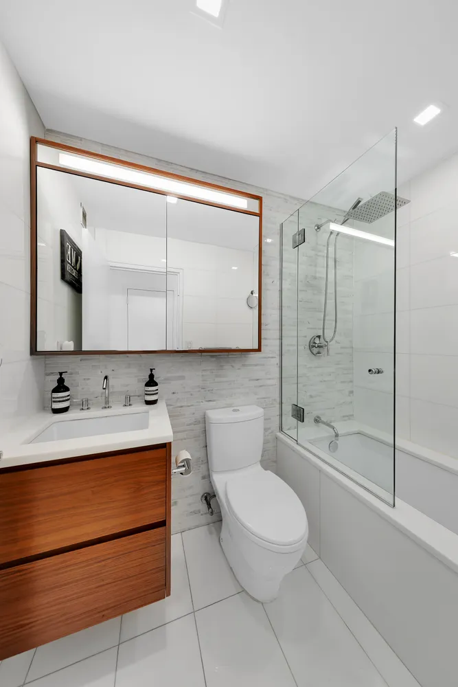a bathroom with a toilet a sink and bathtub