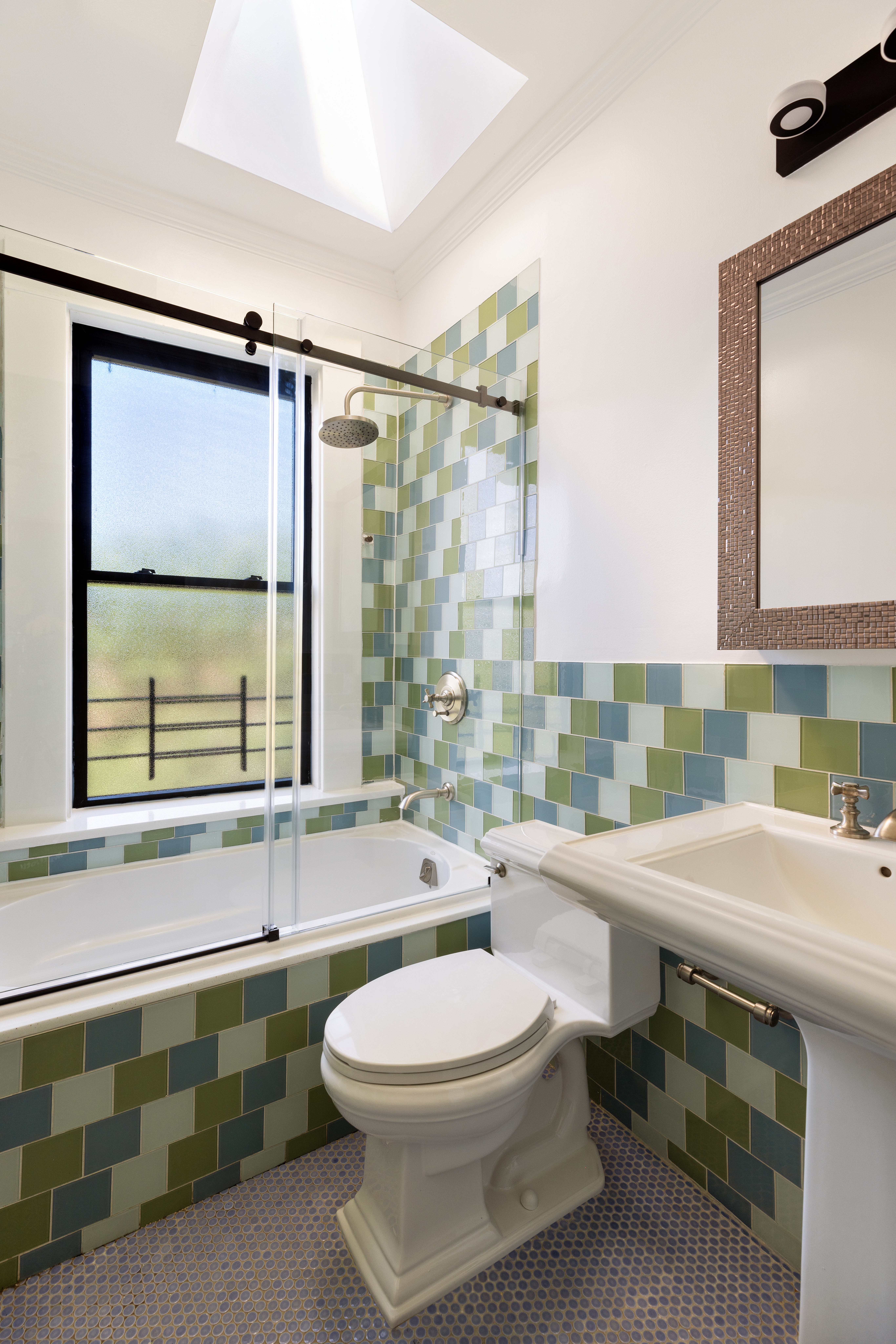 208 Warren Street Brooklyn, NY 11201 - Photo 5 of 10 a bathroom with a double vanity sink toilet and mirror