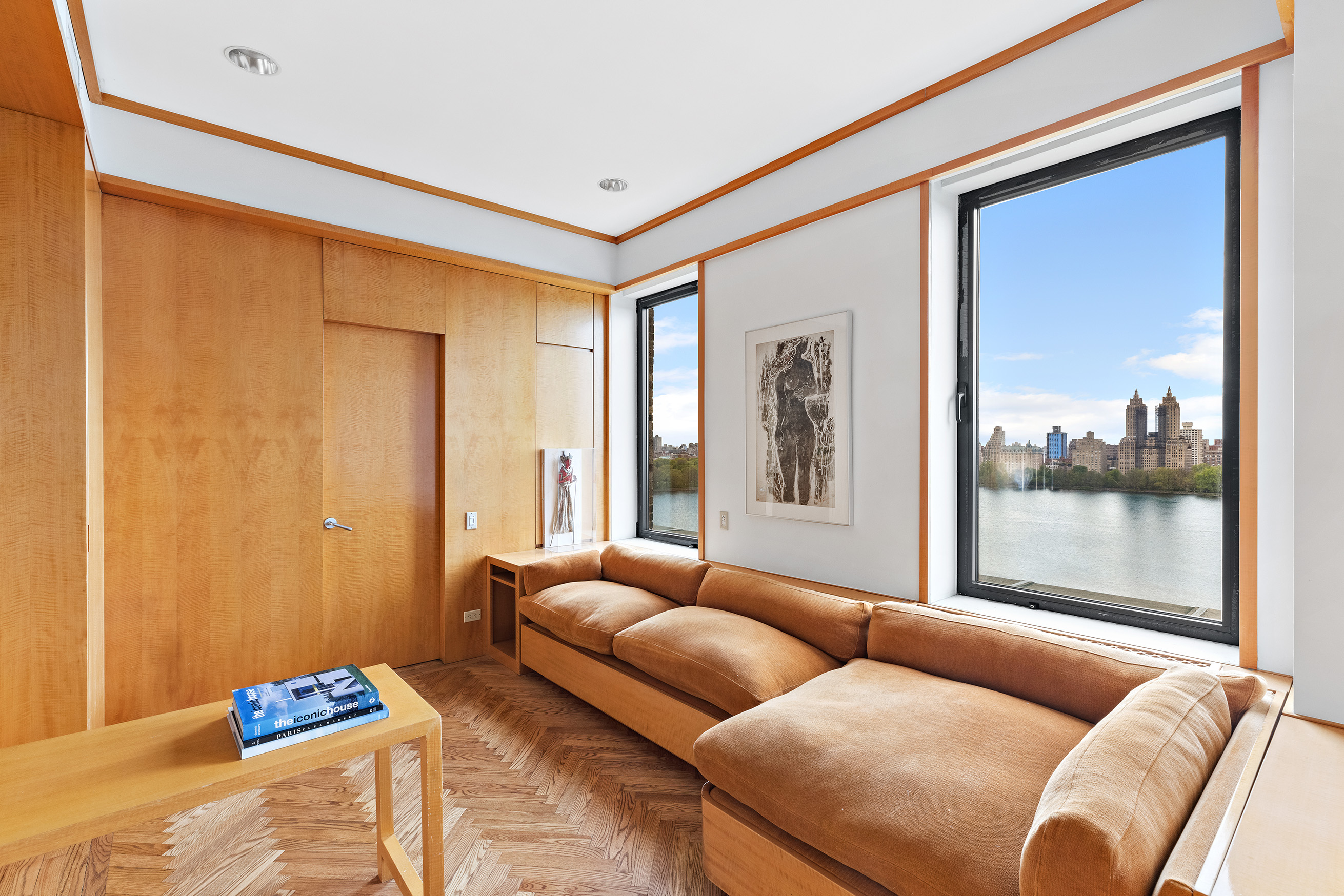 1115 5th Avenue, Unit 15A Manhattan, NY 10128 - Photo 18 of 27 a living room with furniture and a window