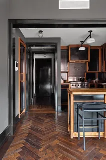 a kitchen with a refrigerator and a stove