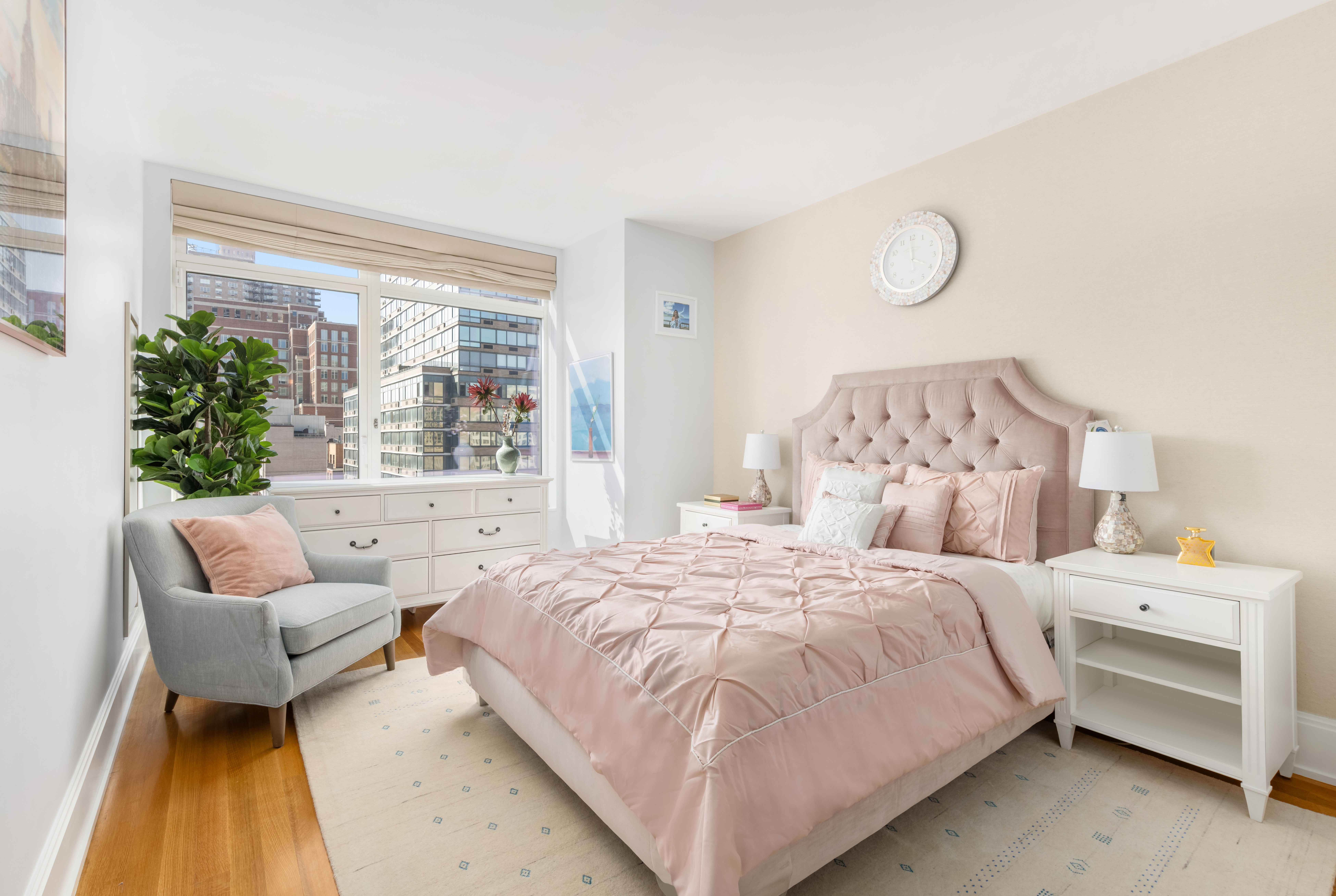 305 East 85th Street, Unit 14D Manhattan, NY 10028 - Photo 8 of 11 a bedroom with a bed and a couch