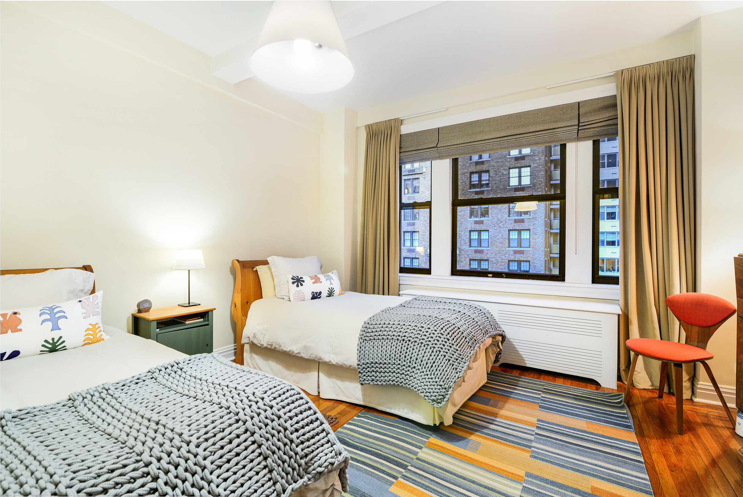20 West 72nd Street, Unit 601 Manhattan, NY 10023 - Photo 17 of 21 a bedroom with double bed and a window