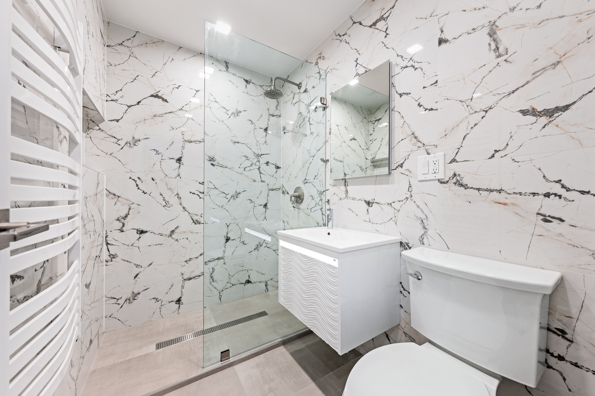 412 Fairview Avenue, Unit 1 Queens, NY 11385 - Photo 9 of 9 a white toilet sitting next to a shower curtain