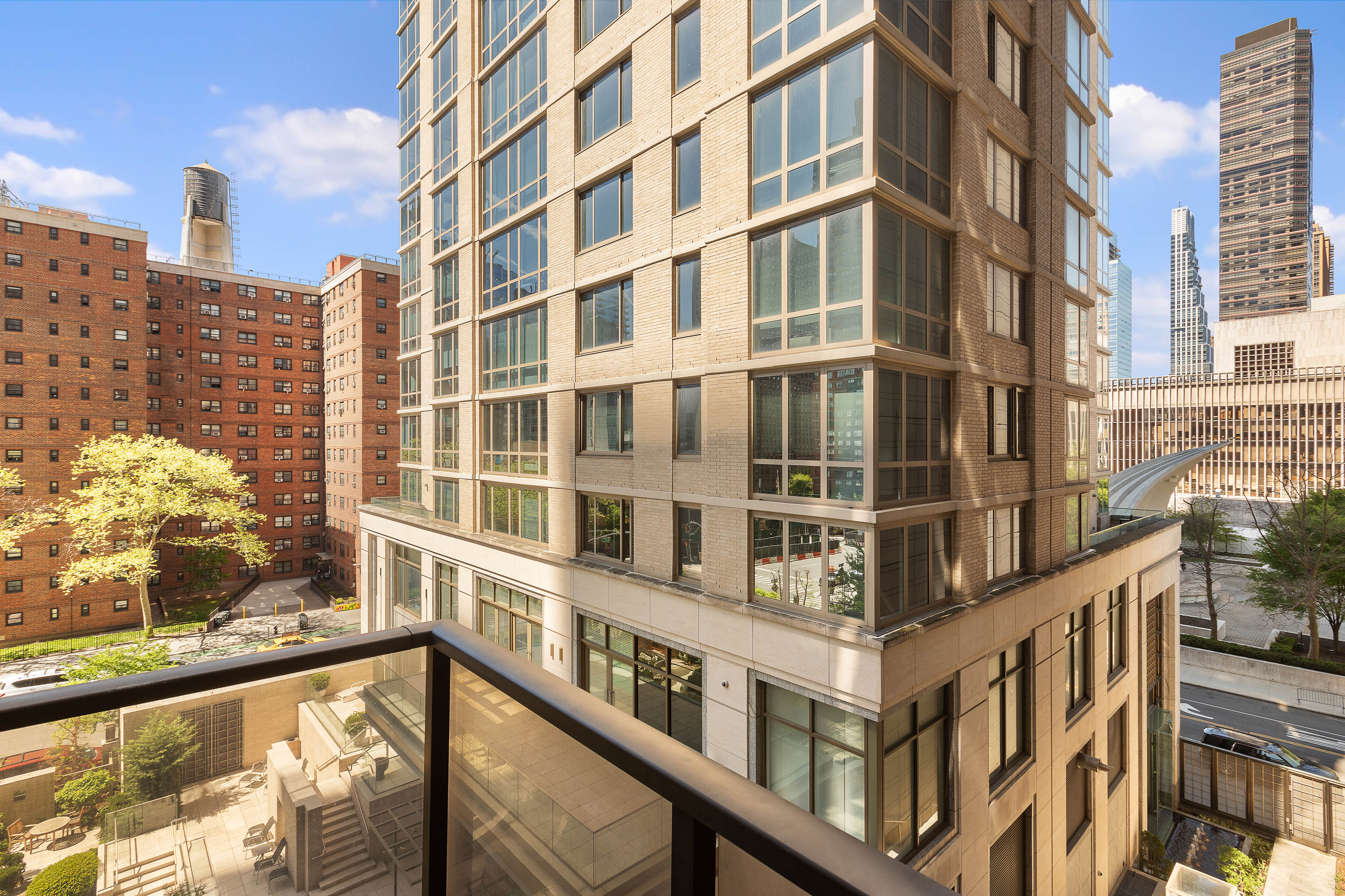 161 West 61st Street, Unit 5C Manhattan, NY 10023 - Photo 3 of 30 a view of a building from a balcony