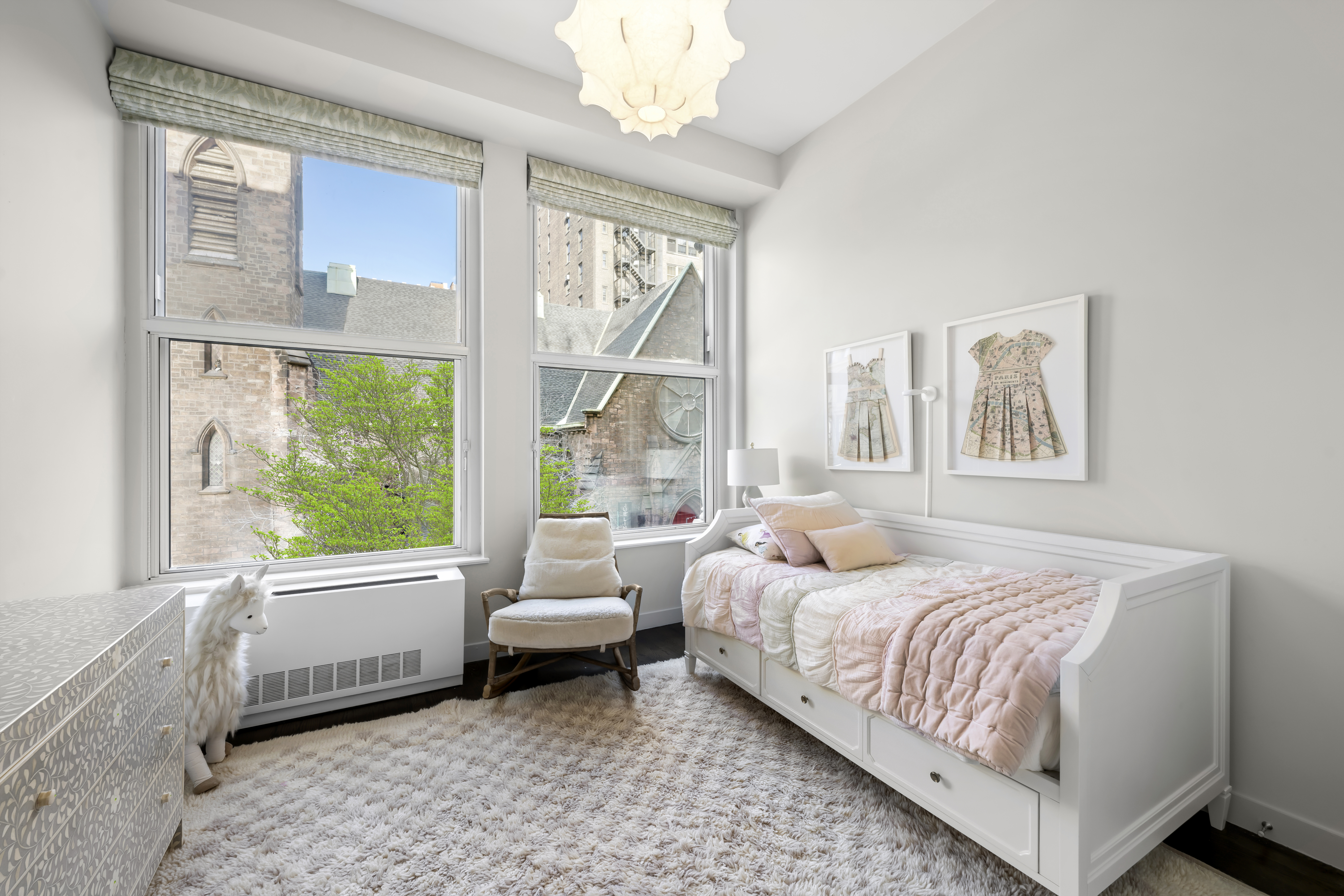 60 West 20th Street, Unit 2F Manhattan, NY 10011 - Photo 11 of 21 a bedroom with a bed and a large window
