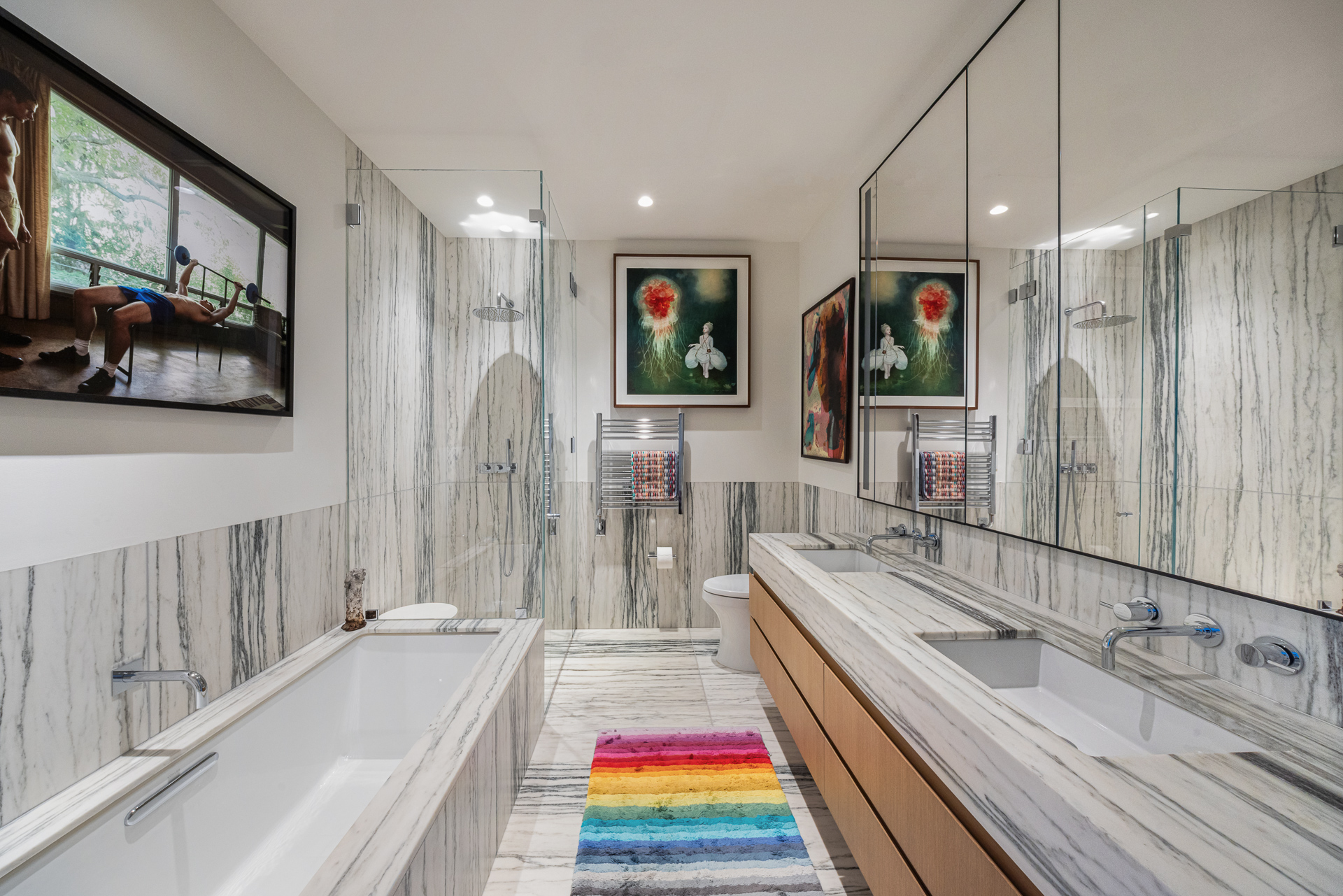 33 Park Row, Unit 6B Manhattan, NY 10038 - Photo 10 of 20 a bathroom with a double vanity sink and mirror