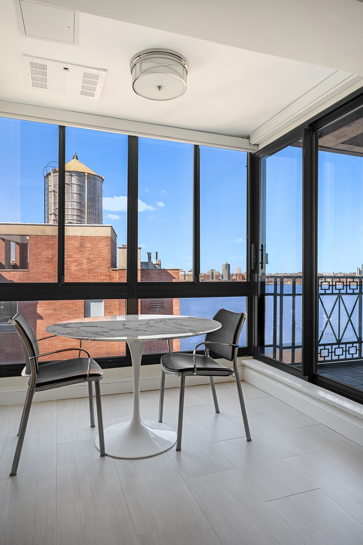 366 West 11th Street, Unit PHF Manhattan, NY 10014 - Photo 8 of 28 a reading room with furniture and a floor to ceiling window