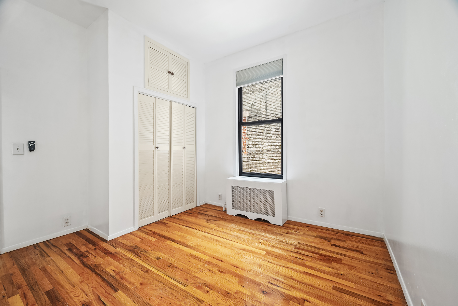 862 West End Avenue, Unit 2R Manhattan, NY 10025 - Photo 2 of 8 a bedroom with a bed and a window