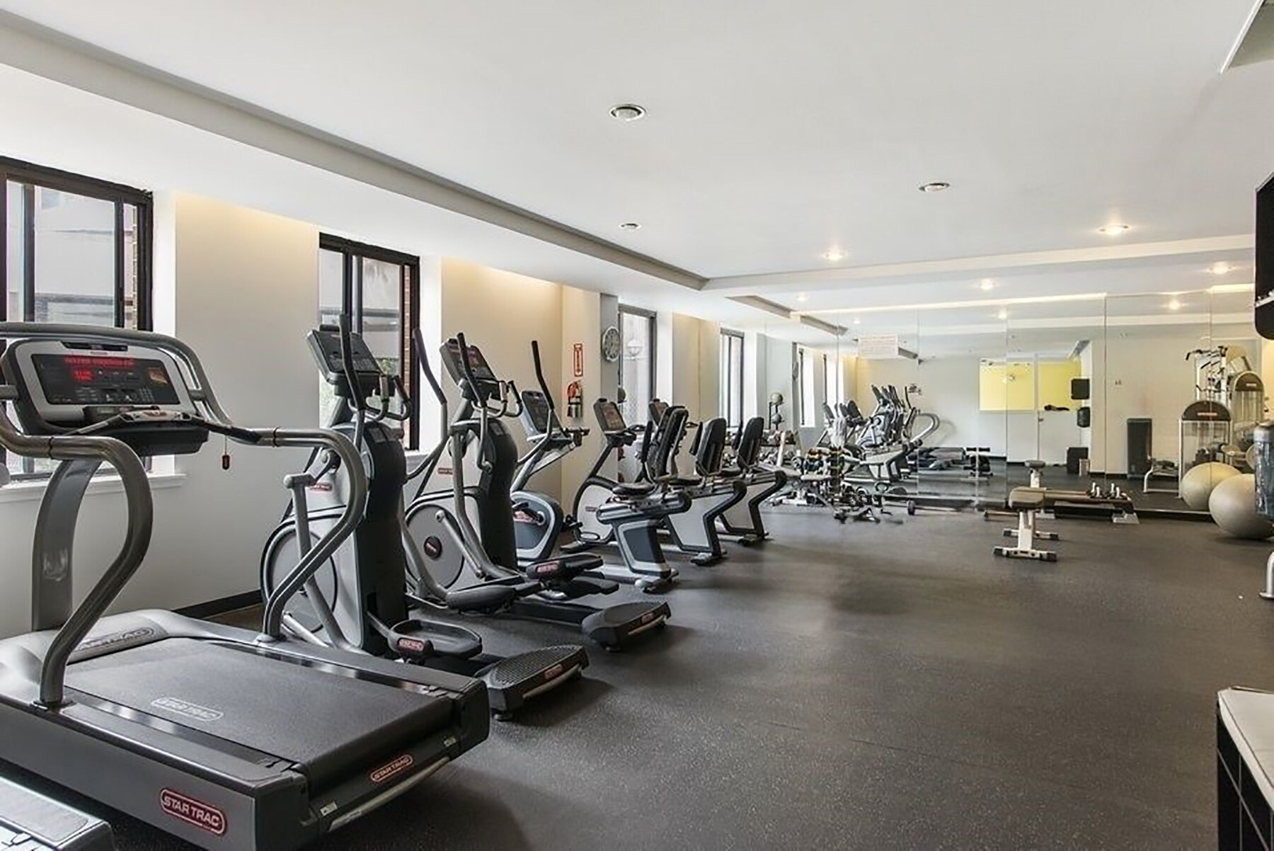 300 Rector Place, Unit 4E Manhattan, NY 10280 - Photo 5 of 9 a view of a room with gym equipment
