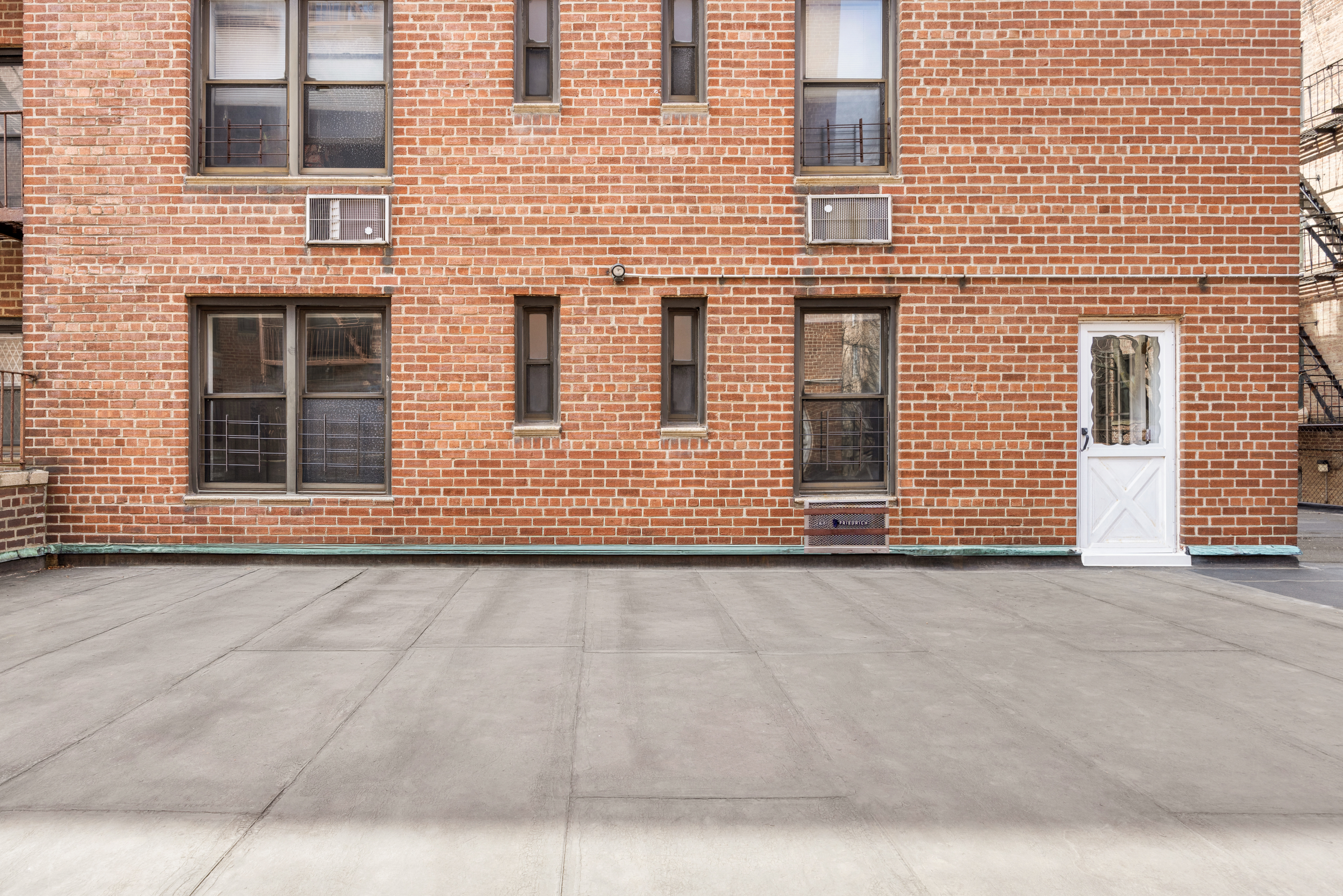 345 Webster Avenue, Unit 1B Brooklyn, NY 11230 - Photo 10 of 13 a view of a brick house with many windows