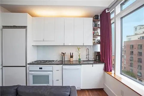 a kitchen with stainless steel appliances granite countertop a refrigerator sink and cabinets