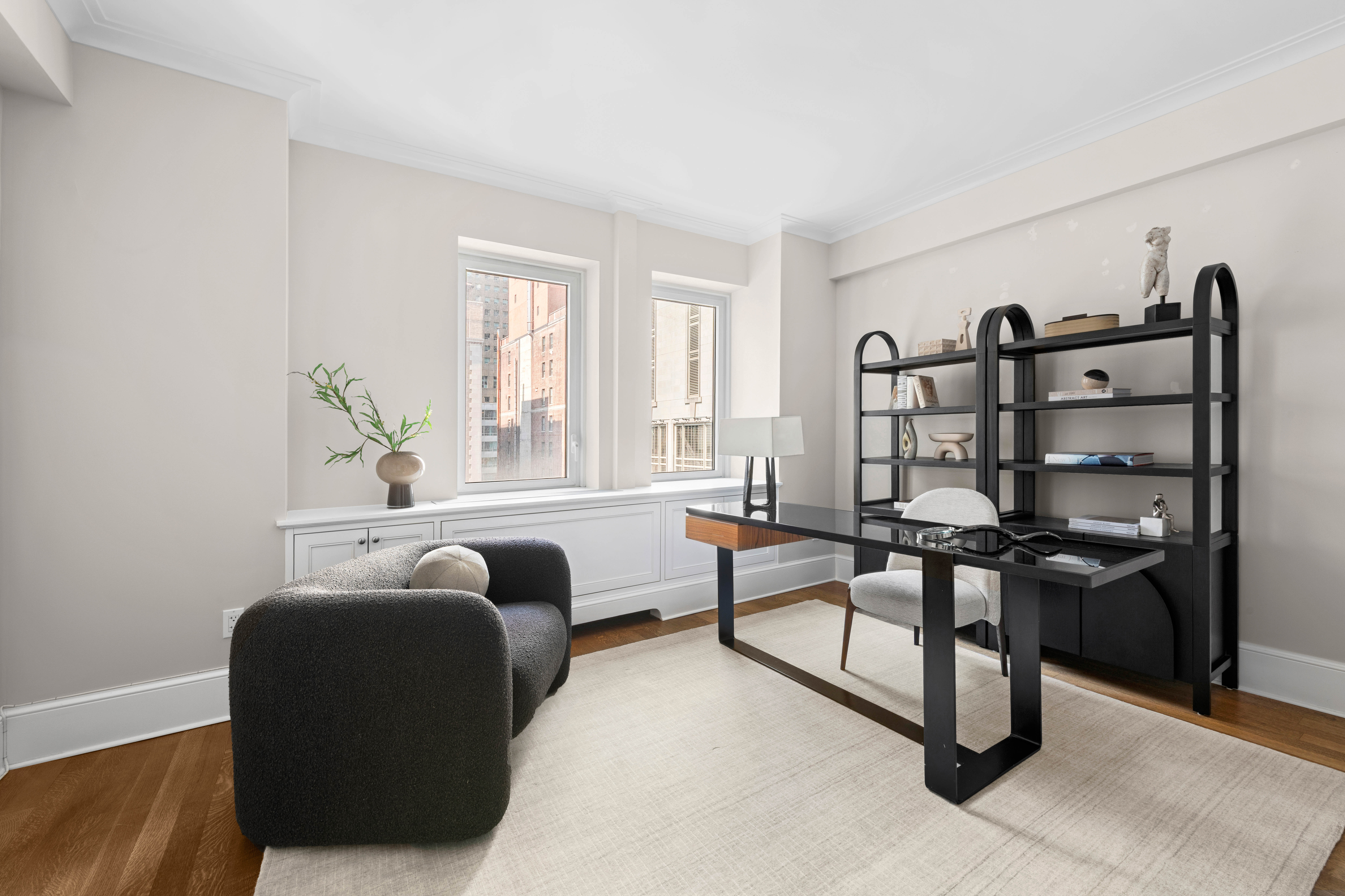 530 Park Avenue, Unit 12A Manhattan, NY 10065 - Photo 16 of 27 a living room with furniture and a window