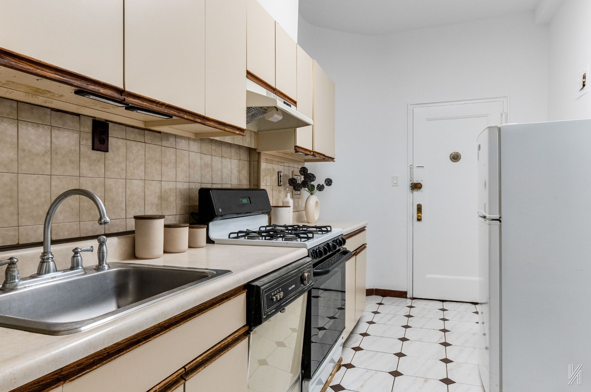 39-30 52nd Street, Unit GA Queens, NY 11377 - Photo 9 of 15 a kitchen with stainless steel appliances a sink a stove and a refrigerator