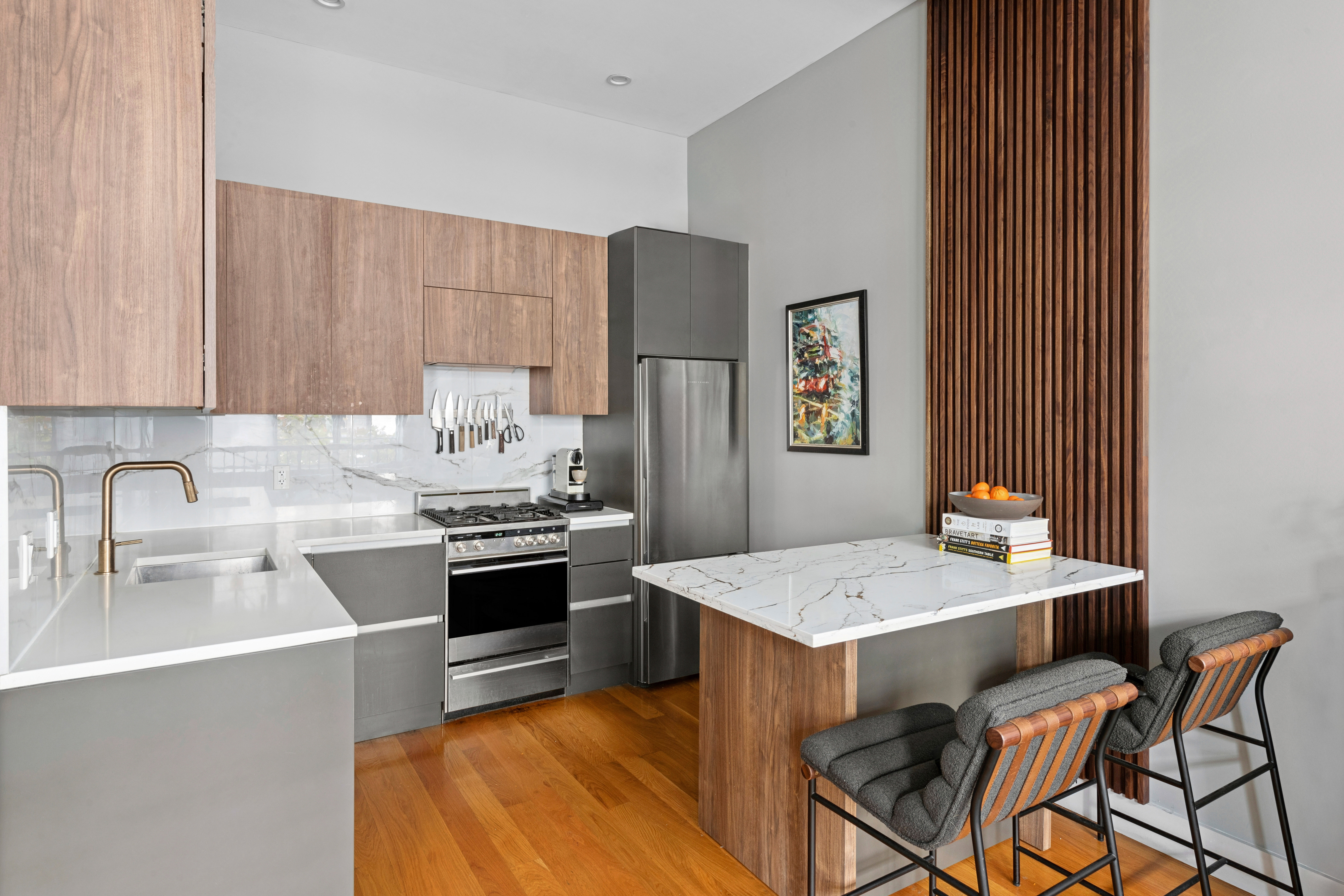 222 Withers Street, Unit 1A Brooklyn, NY 11211 - Photo 5 of 15 a kitchen with stainless steel appliances granite countertop a sink stove and refrigerator