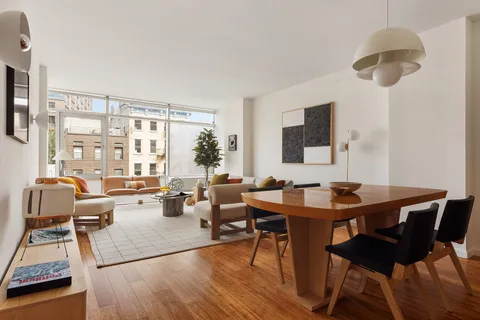 a view of a livingroom with furniture and a table