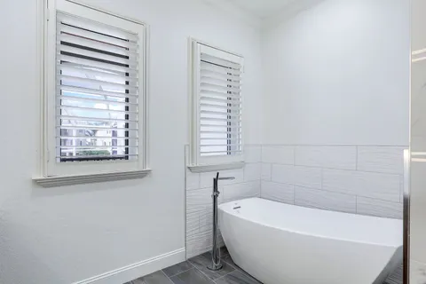 a bathroom with a sink a vanity and a mirror