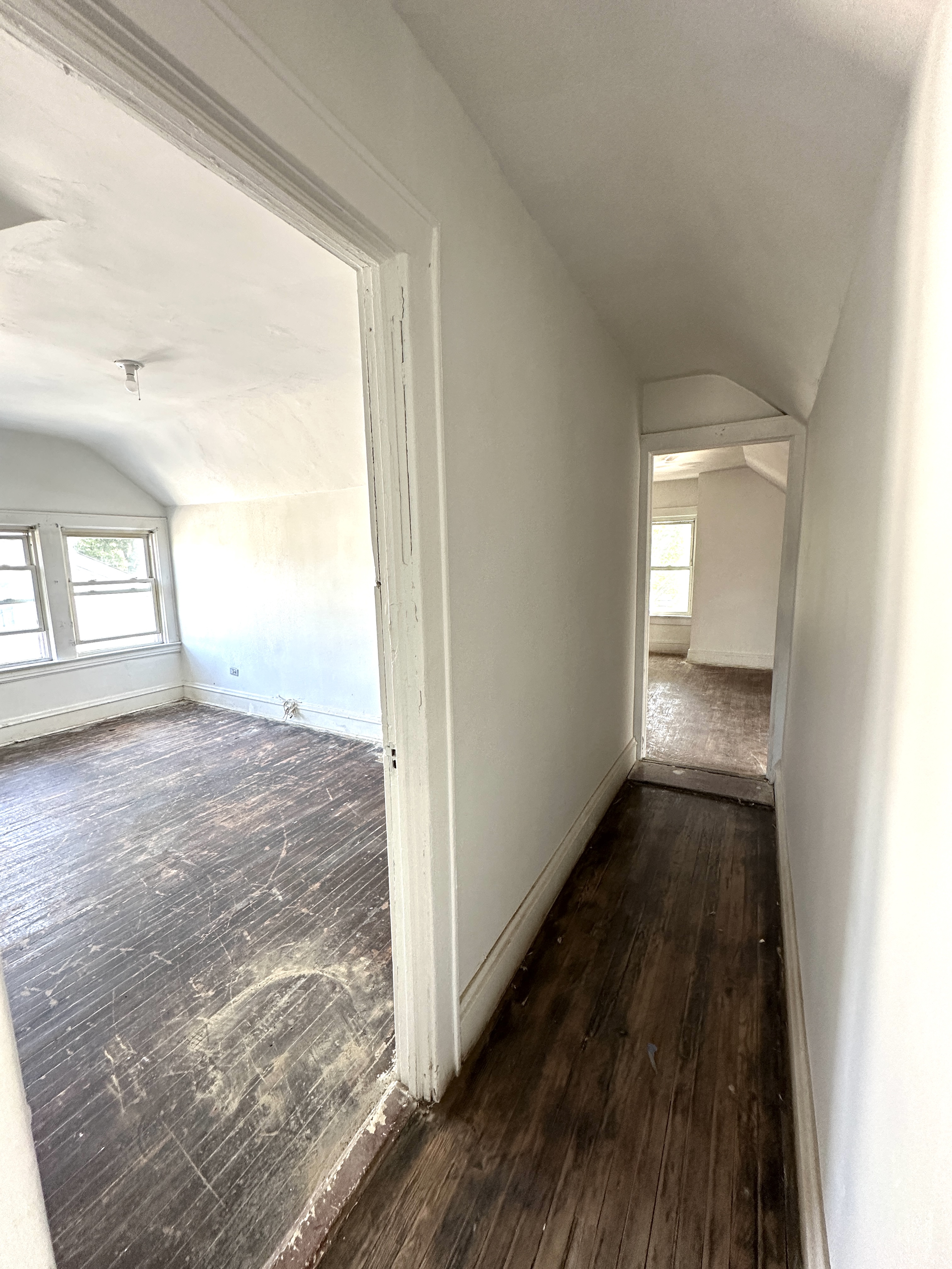 92-64 Springfield Boulevard Queens, NY 11428 - Photo 21 of 25 a view of a hallway with wooden floor and windows