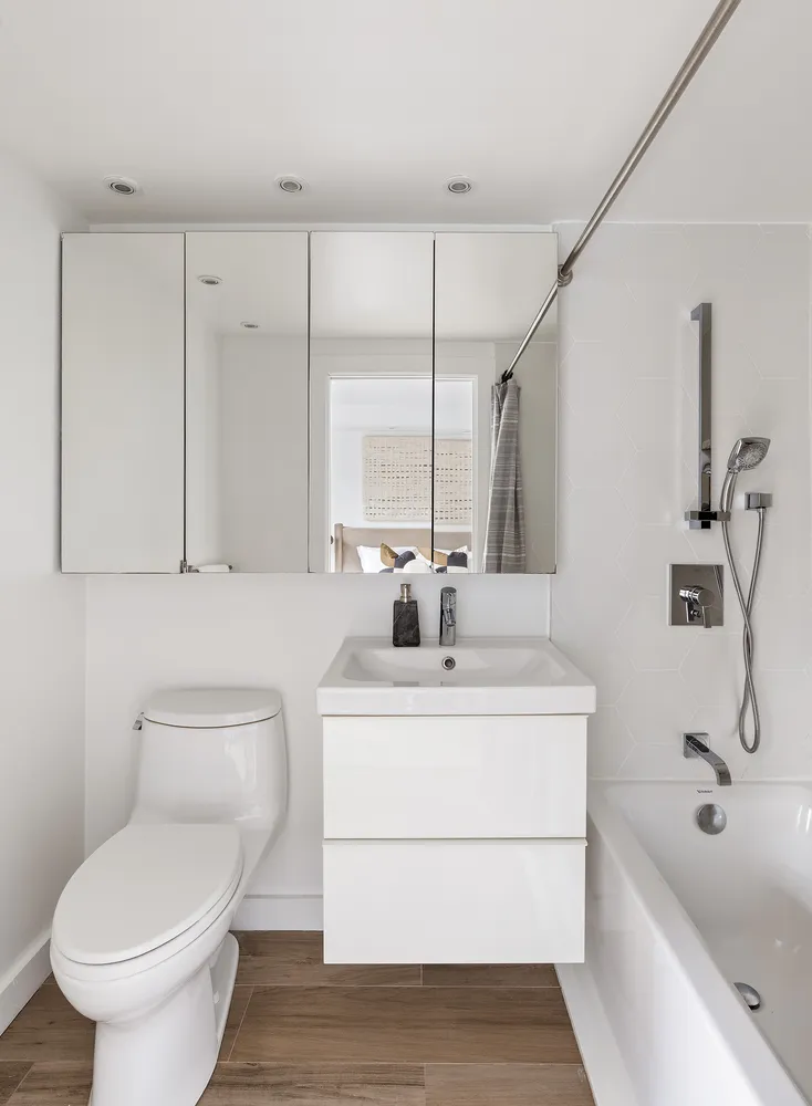 a bathroom with a sink a toilet and bathtub