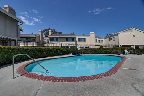 a view of a swimming pool and a chairs
