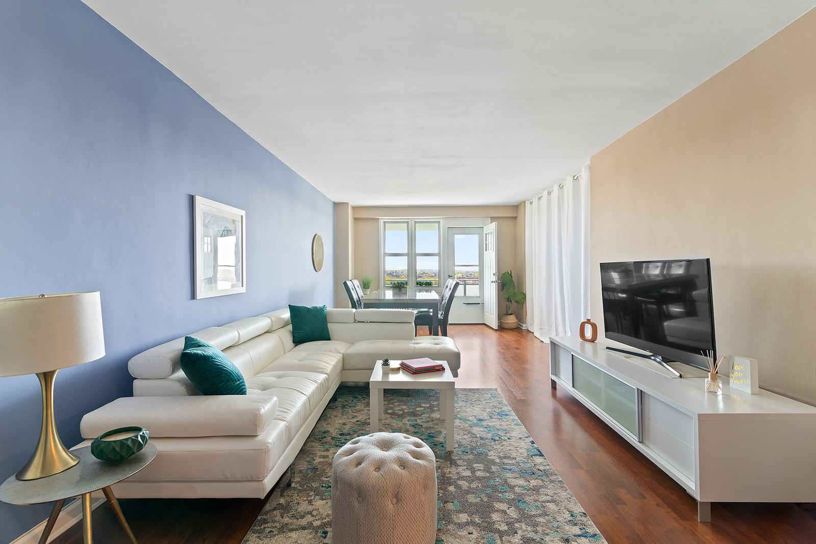 370 Ocean Parkway, Unit 12K Brooklyn, NY 11218 - Photo 1 of 15 a living room with furniture and a flat screen tv