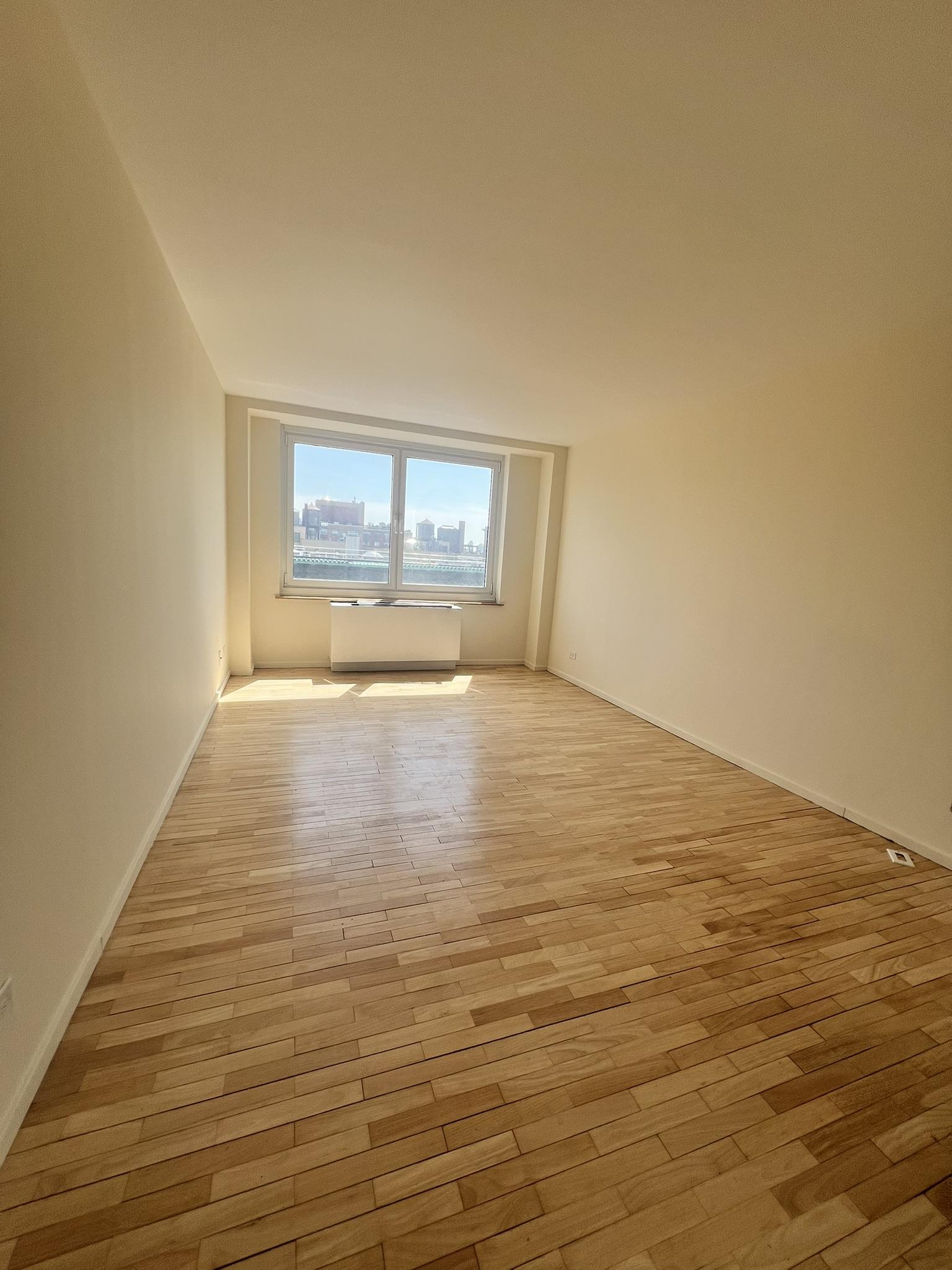 250 West 90th Street, Unit PH2F Manhattan, NY 10024 - Photo 3 of 21 a view of empty room with wooden floor