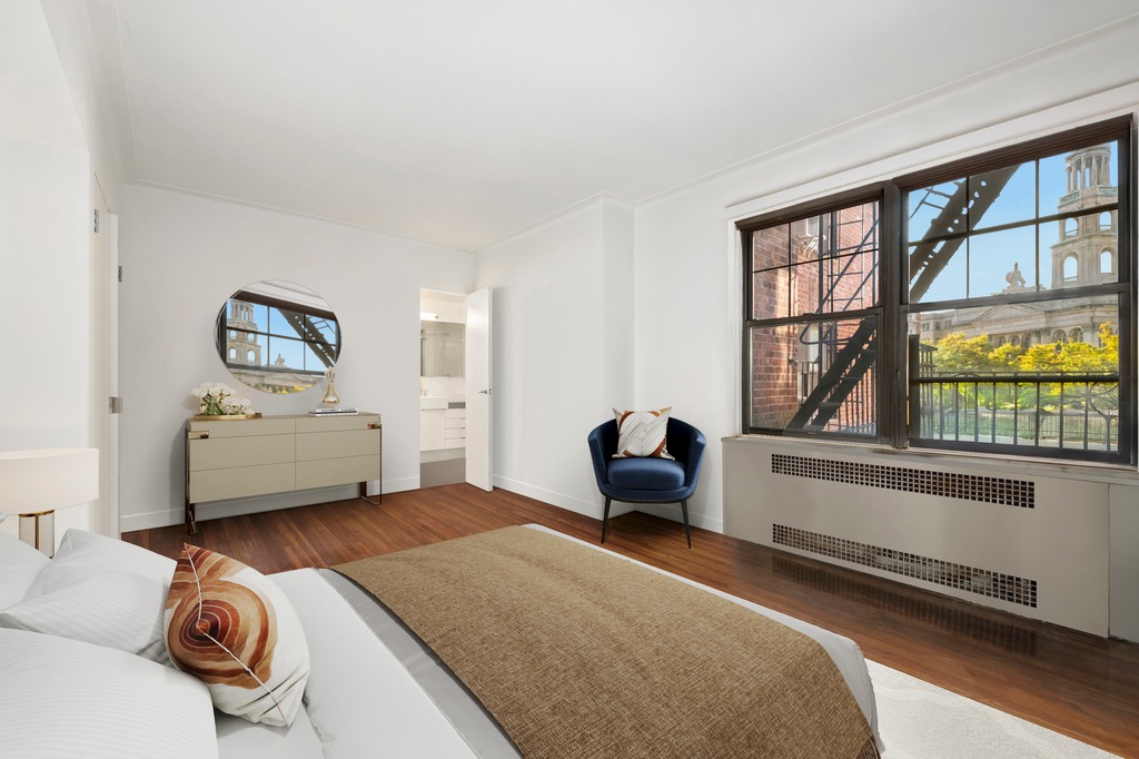 290 6th Avenue, Unit 2KL Manhattan, NY 10014 - Photo 7 of 18 a bedroom with furniture and a large window