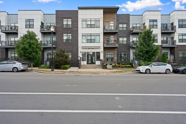 a view of a street with a cars on road