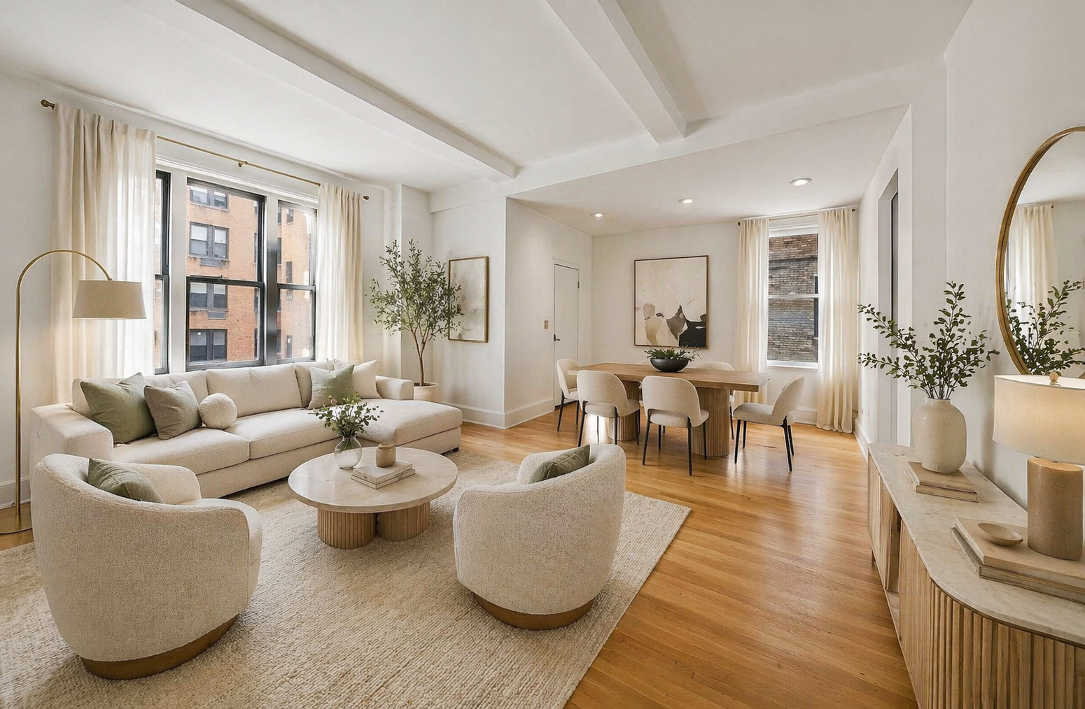 a living room with furniture and wooden floor