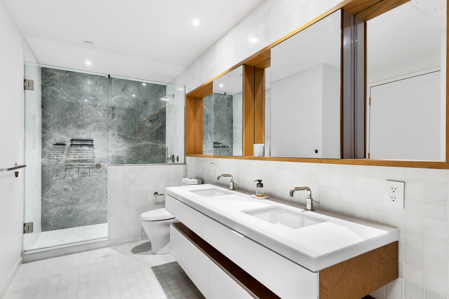 30 Warren Street, Unit 2C Manhattan, NY 10007 - Photo 8 of 18 a bathroom with a sink toilet and shower