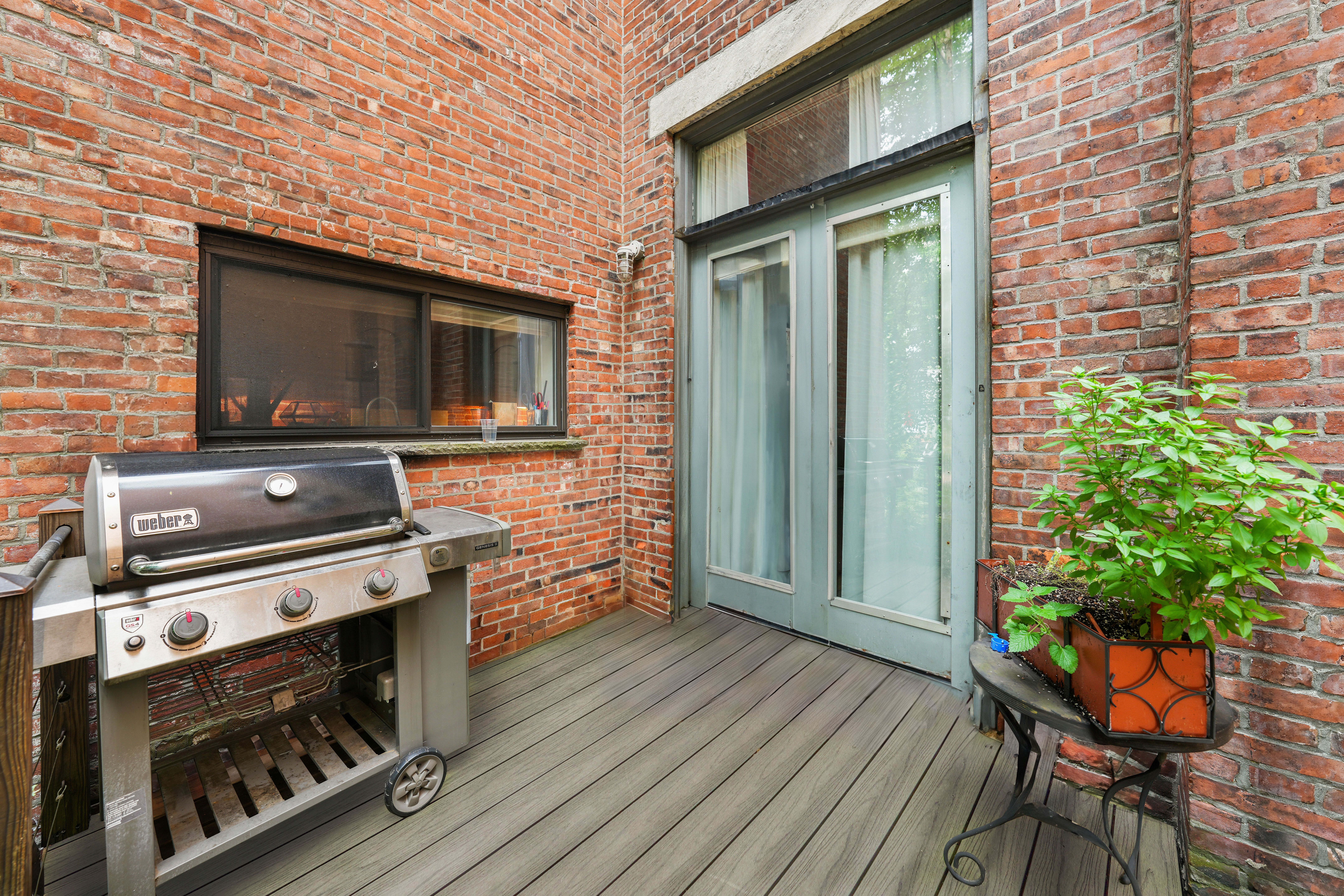 109 West 118th Street Manhattan, NY 10026 - Photo 28 of 31 a view of a livingroom with furniture and wooden floor