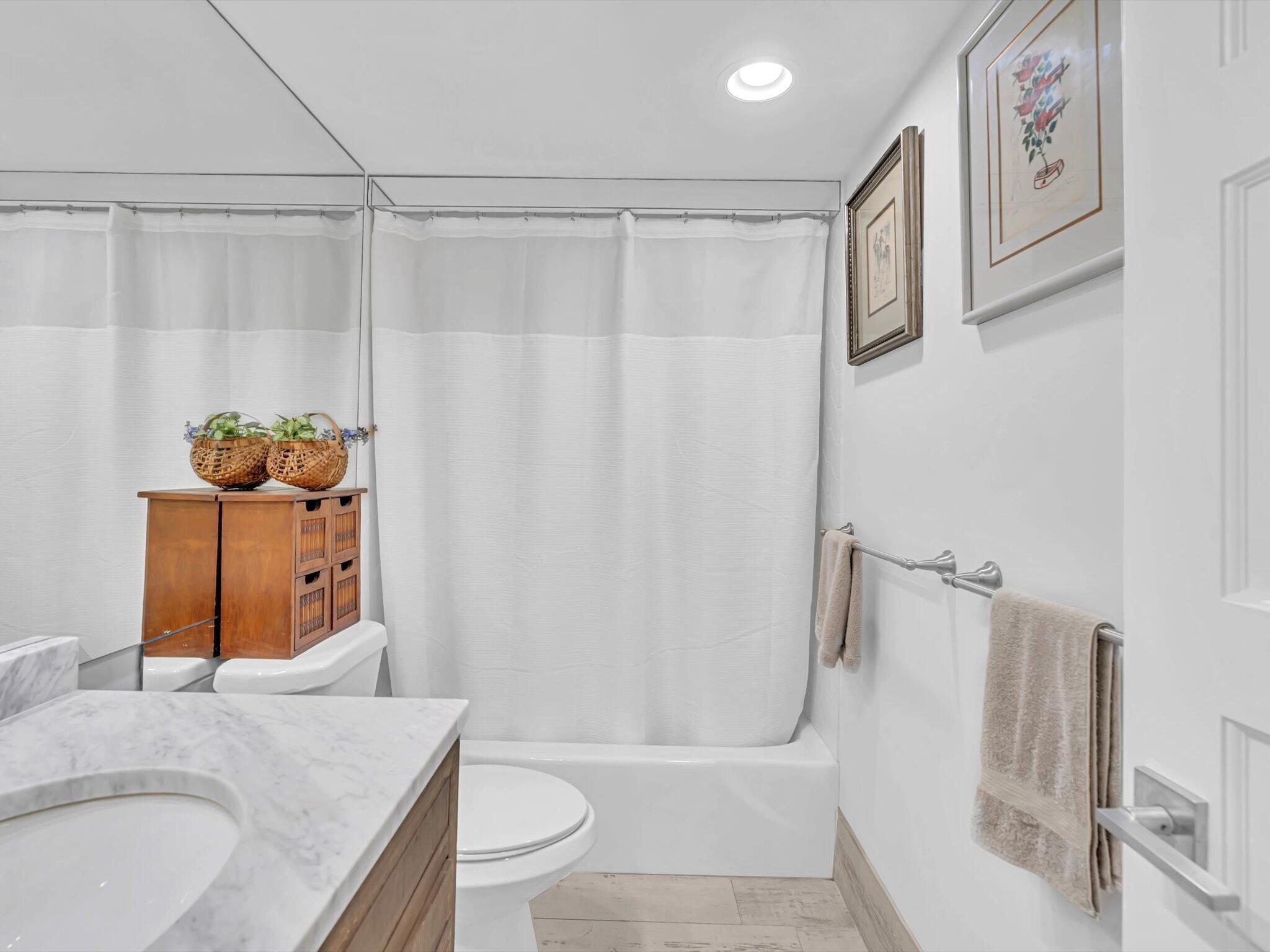 3000 South Ocean Boulevard, Unit 1504 Boca Raton, FL 33432 - Photo 19 of 64 a bathroom with a granite countertop sink and a mirror