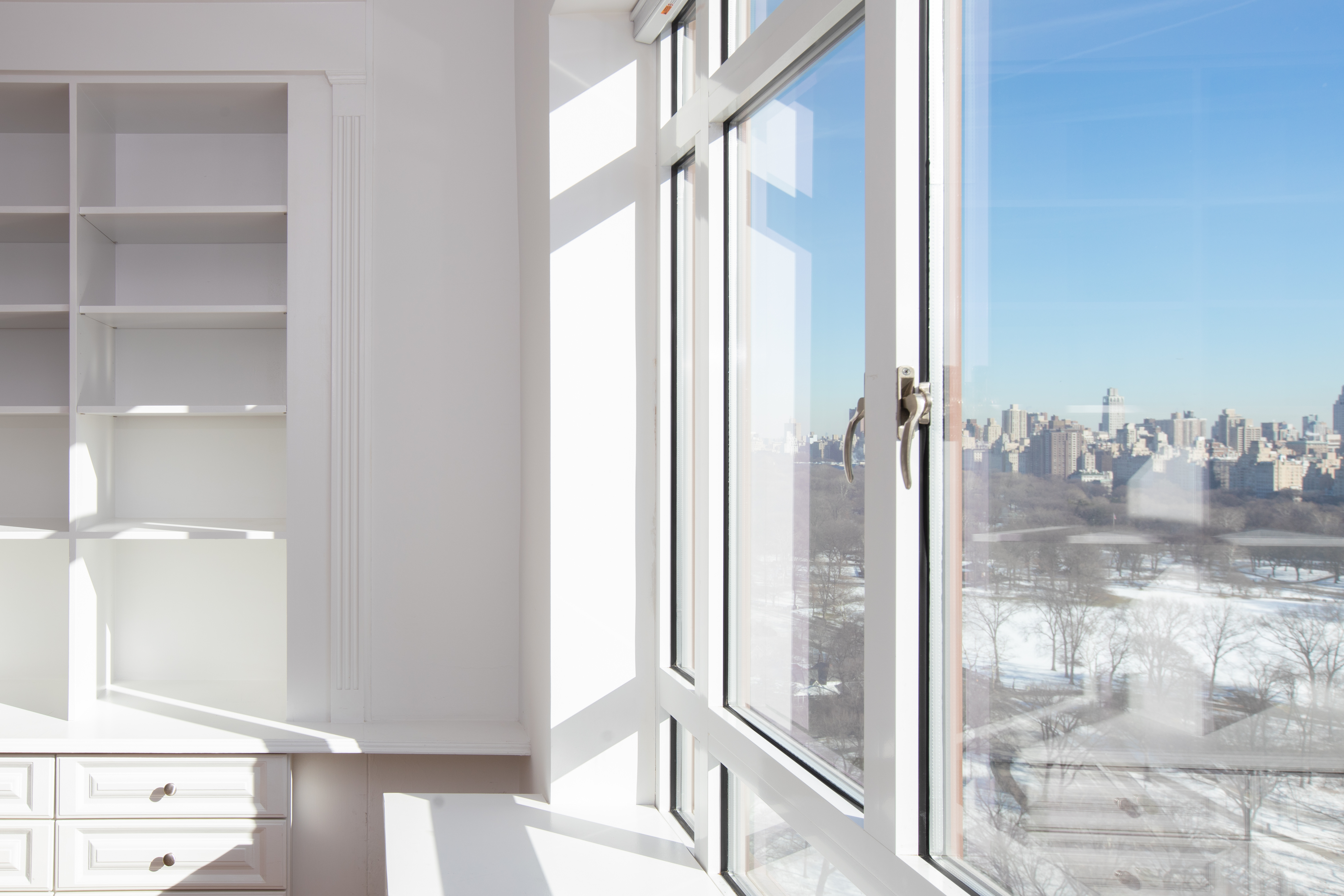 25 Central Park West, Unit 25K Manhattan, NY 10023 - Photo 6 of 14 a bathroom with a glass shower door and a glass door