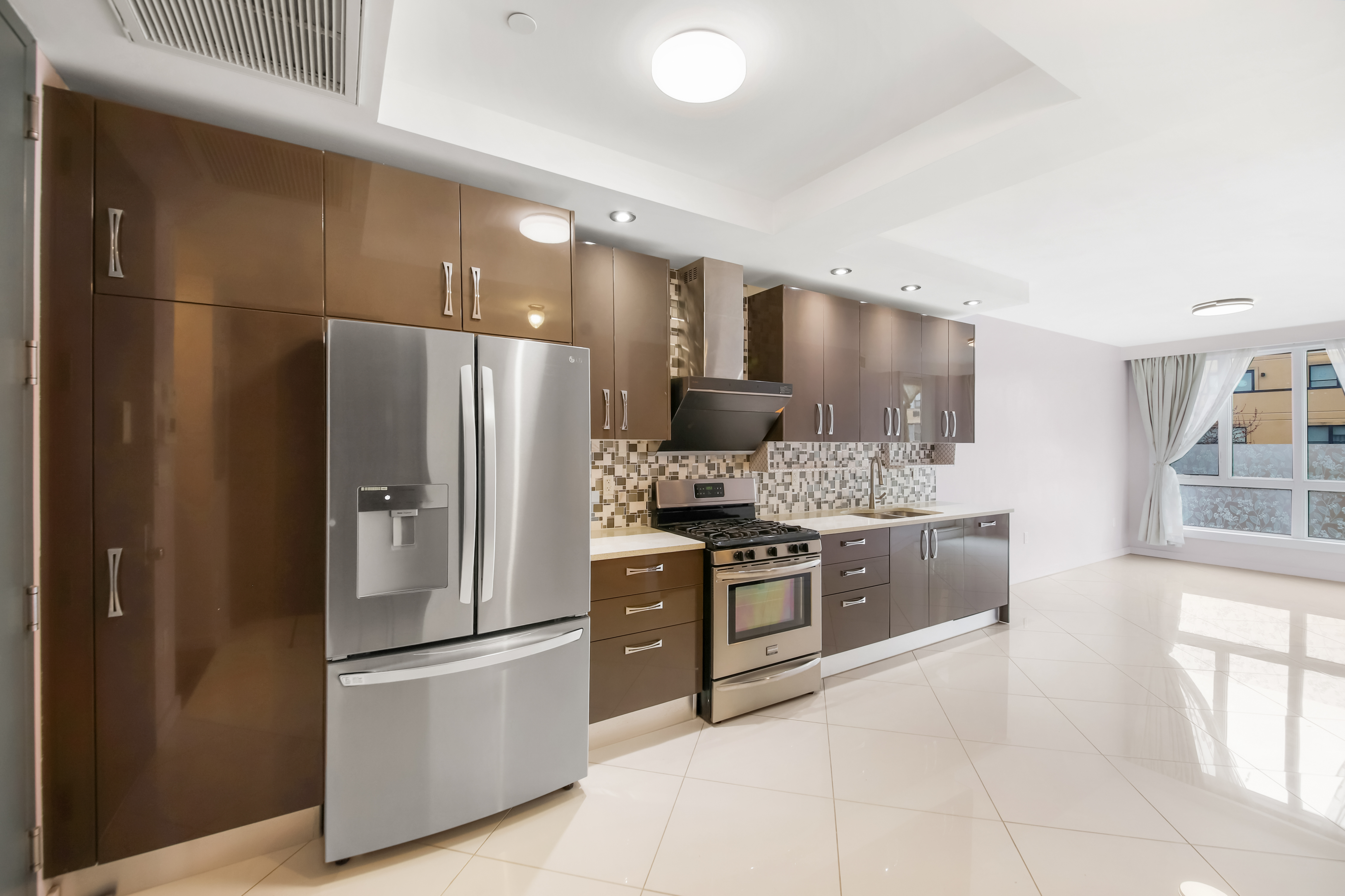1756 Ocean Avenue, Unit 6D Brooklyn, NY 11230 - Photo 4 of 11 a kitchen with stainless steel appliances granite countertop a refrigerator and a stove top oven