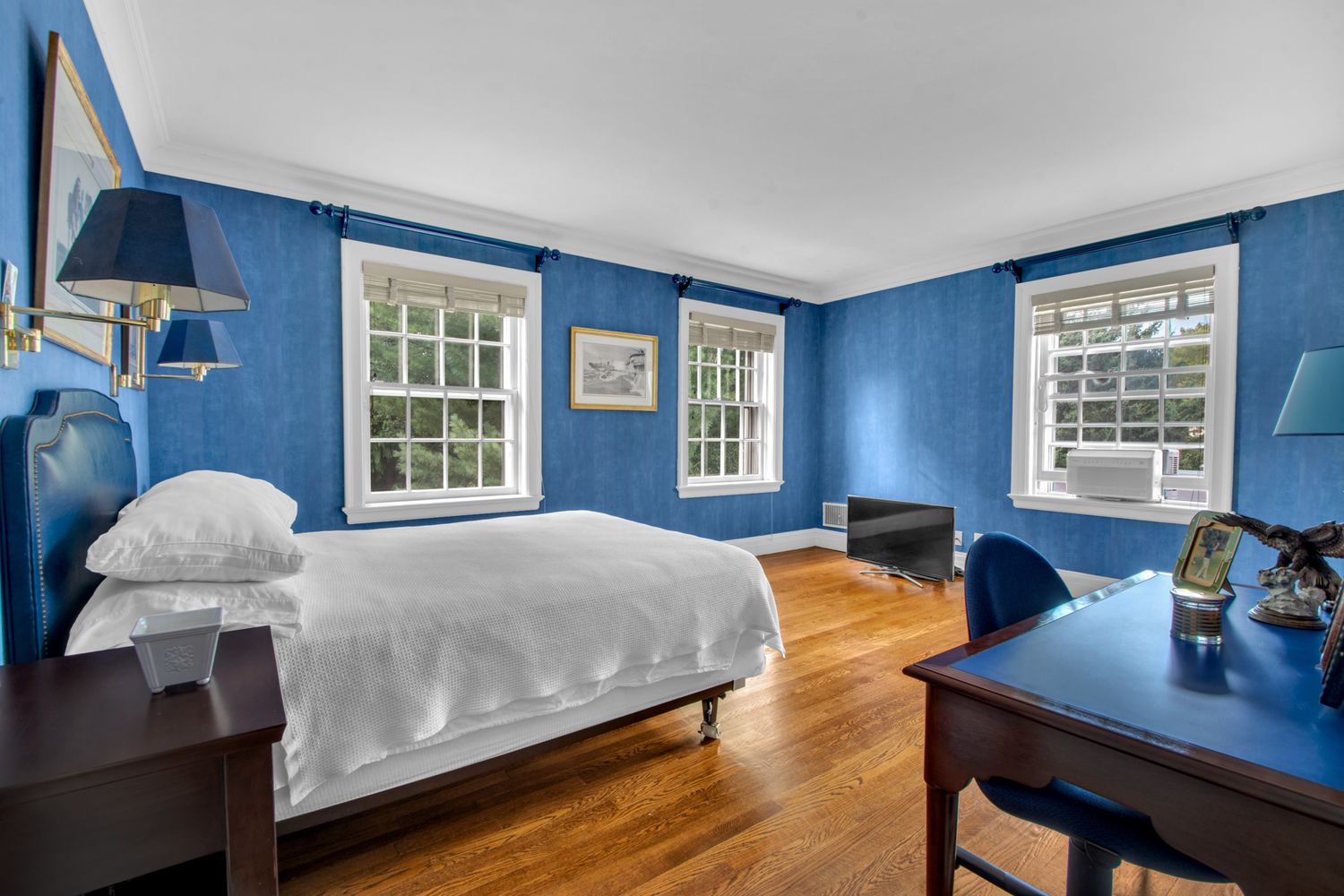 a bed room with a bed and a window