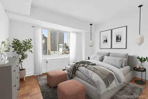 a bedroom with bed and a window