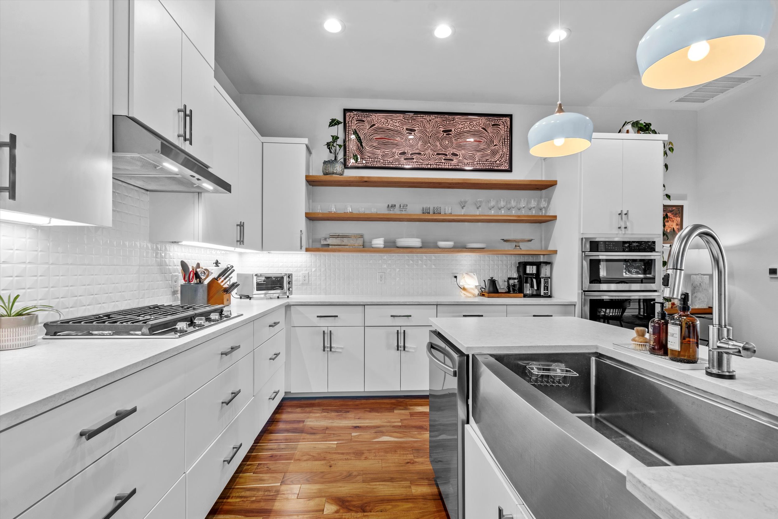 2712 Oak Springs Drive, Unit A Austin, TX 78702 - Photo 26 of 38 a kitchen with a sink cabinets and stainless steel appliances