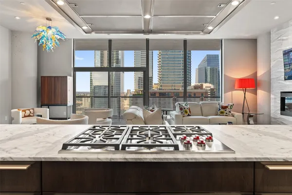 a view of a living room and kitchen