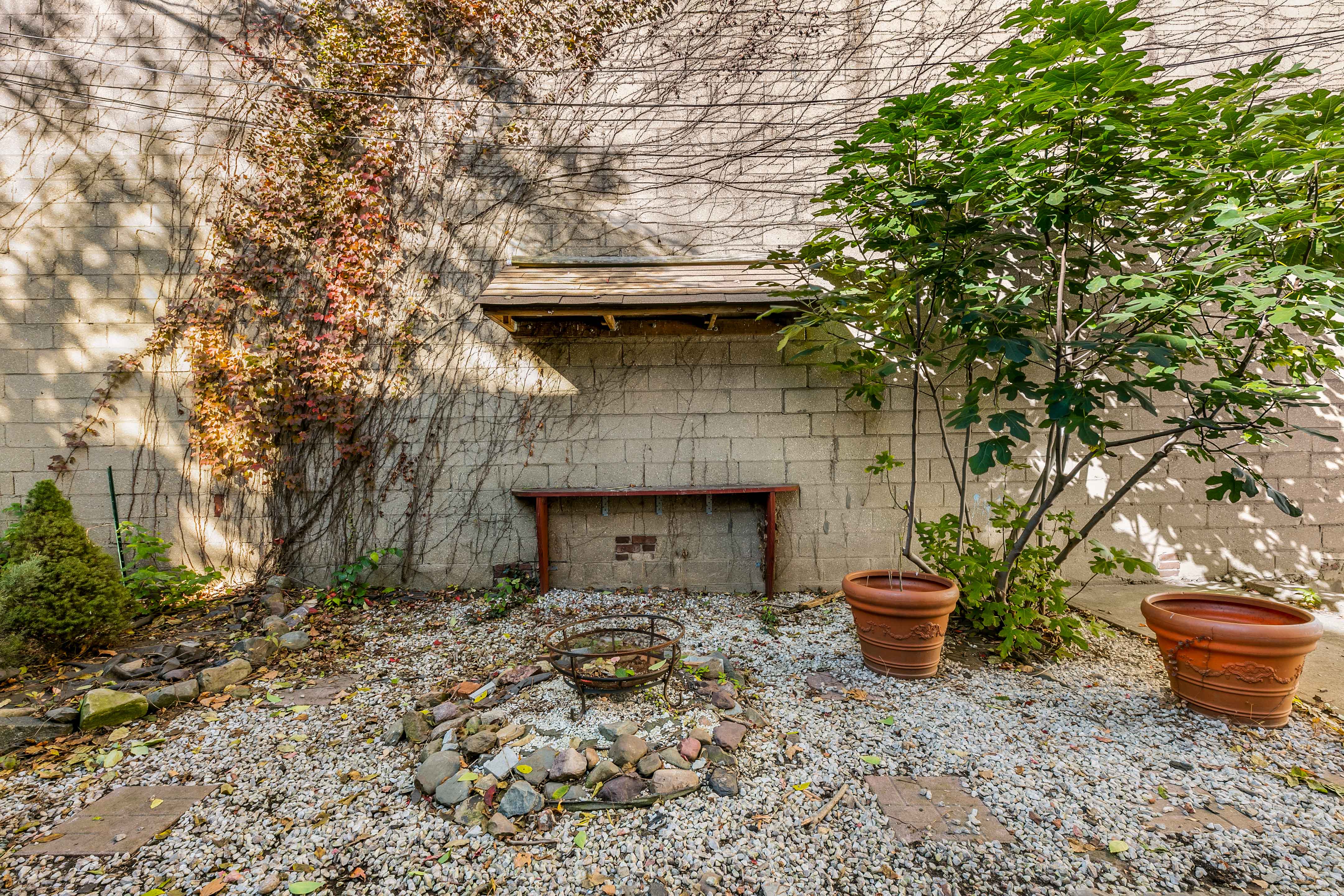 148 29th Street Brooklyn, NY 11232 - Photo 25 of 31 a backyard of a house with table and chairs