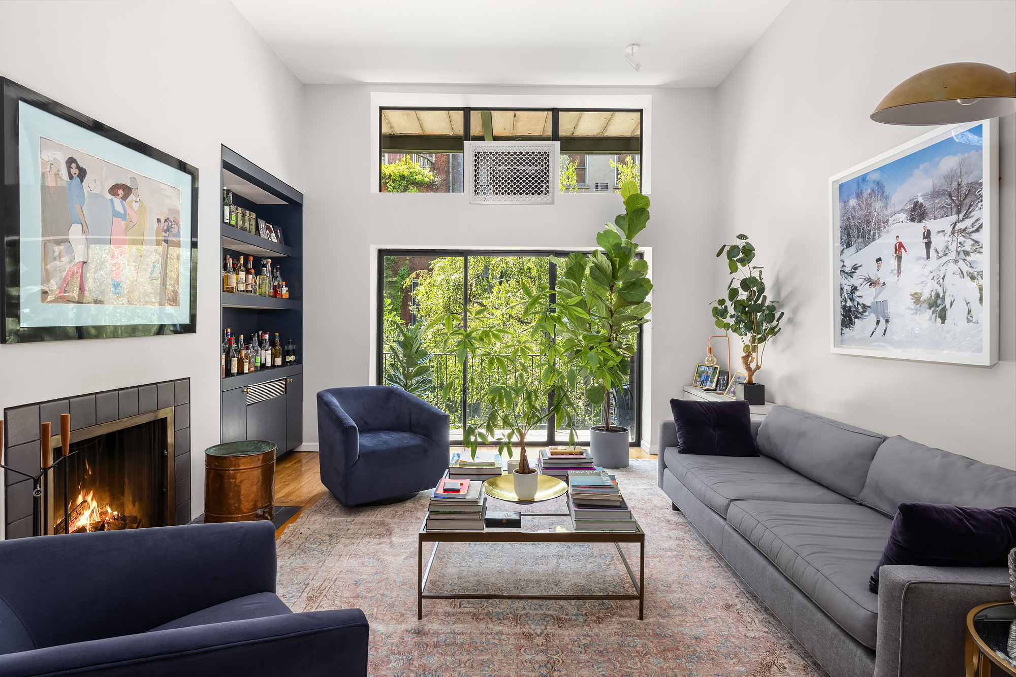 430 West 23rd Street, Unit C Manhattan, NY 10011 - Photo 2 of 16 a living room with furniture and a fireplace