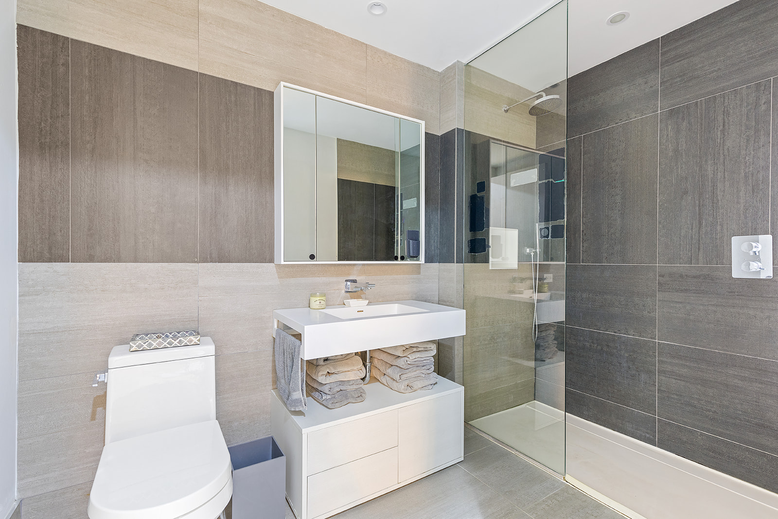 540 West 49th Street, Unit 108N Manhattan, NY 10019 - Photo 4 of 9 a bathroom with a sink toilet and shower