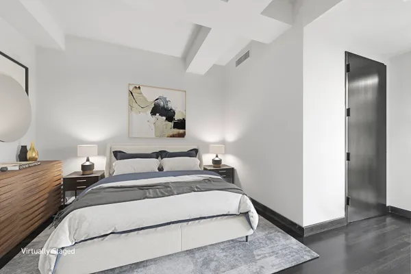 a bedroom with a bed and a painting