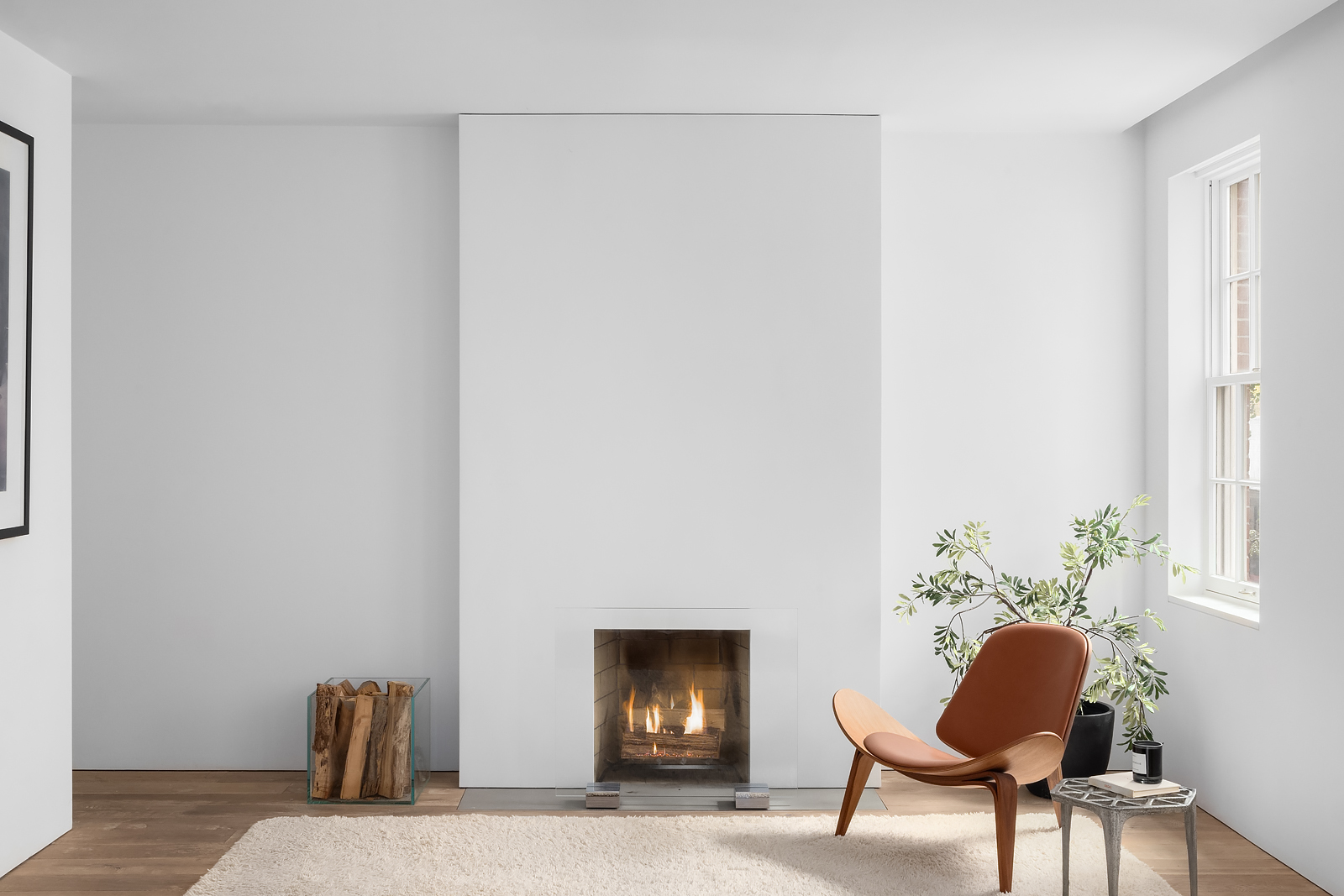 130 Charles Street Manhattan, NY 10014 - Photo 8 of 14 a room with a chair and a potted plant