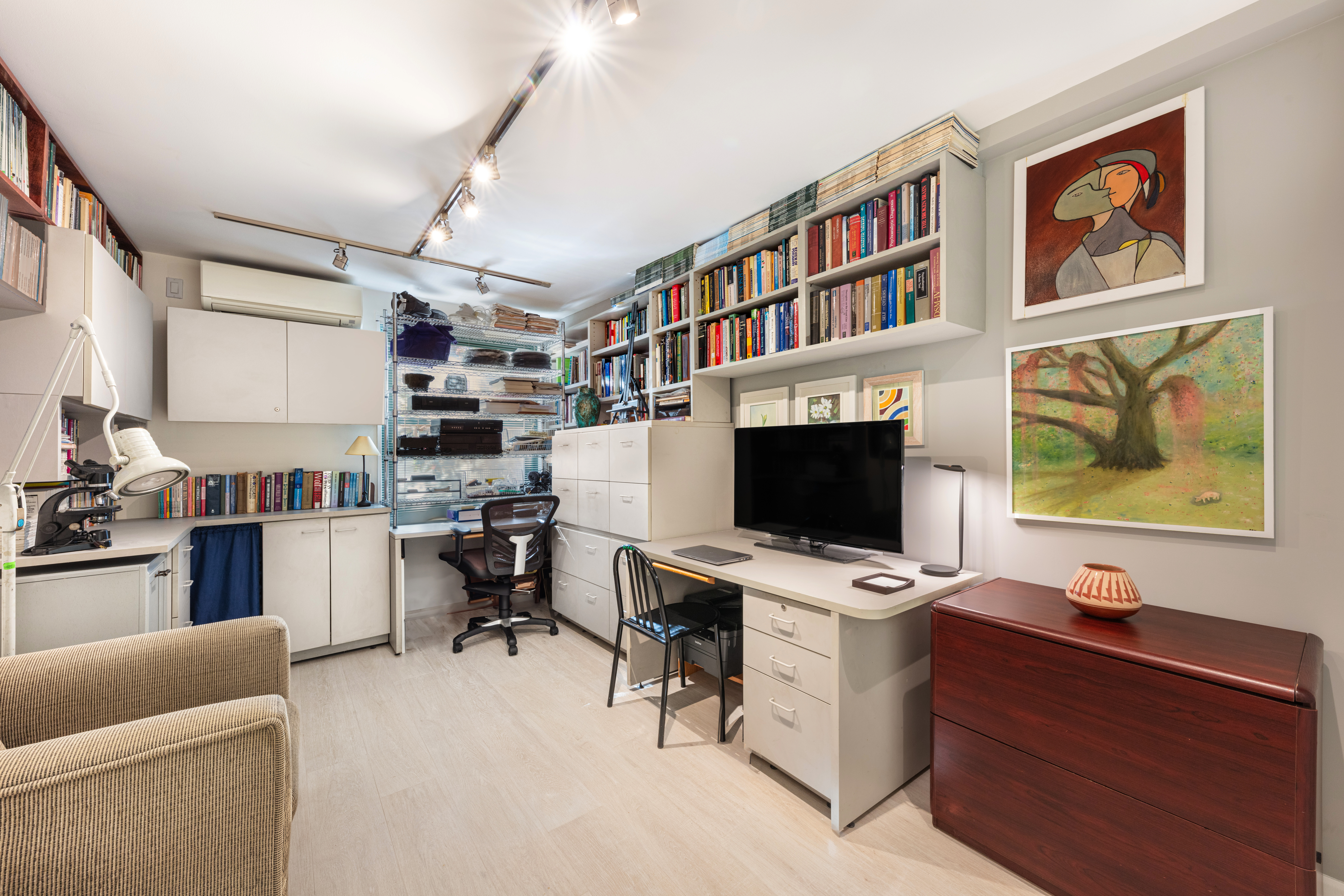 129 Barrow Street, Unit GA Manhattan, NY 10014 - Photo 14 of 17 a view of a workspace with furniture and a window