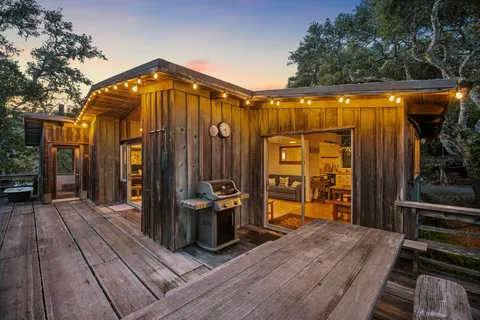 a view of outdoor space and deck with furniture