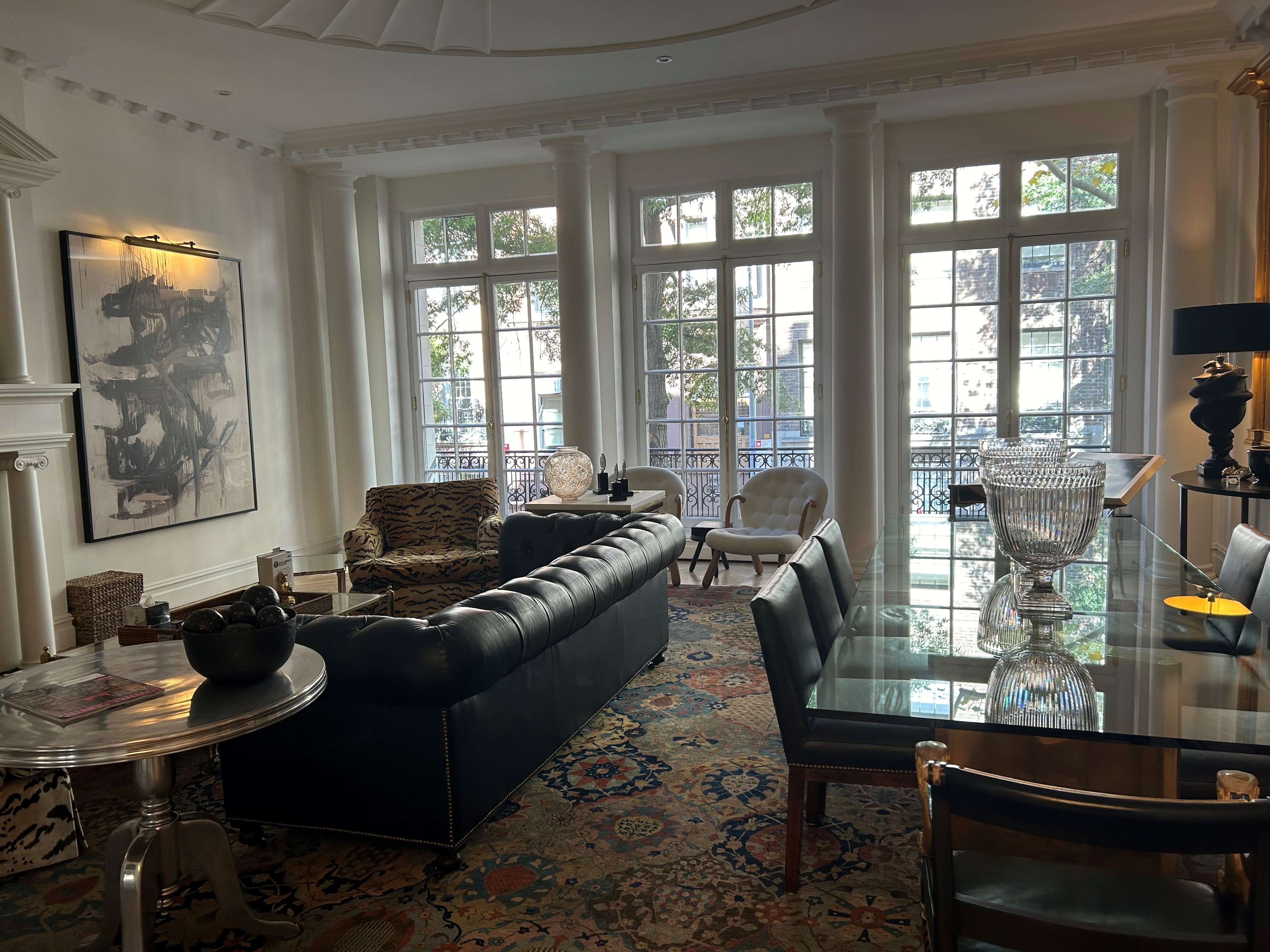 36 East 69th Street, Unit 2AB Manhattan, NY 10021 - Photo 5 of 26 a living room with furniture and a floor to ceiling window
