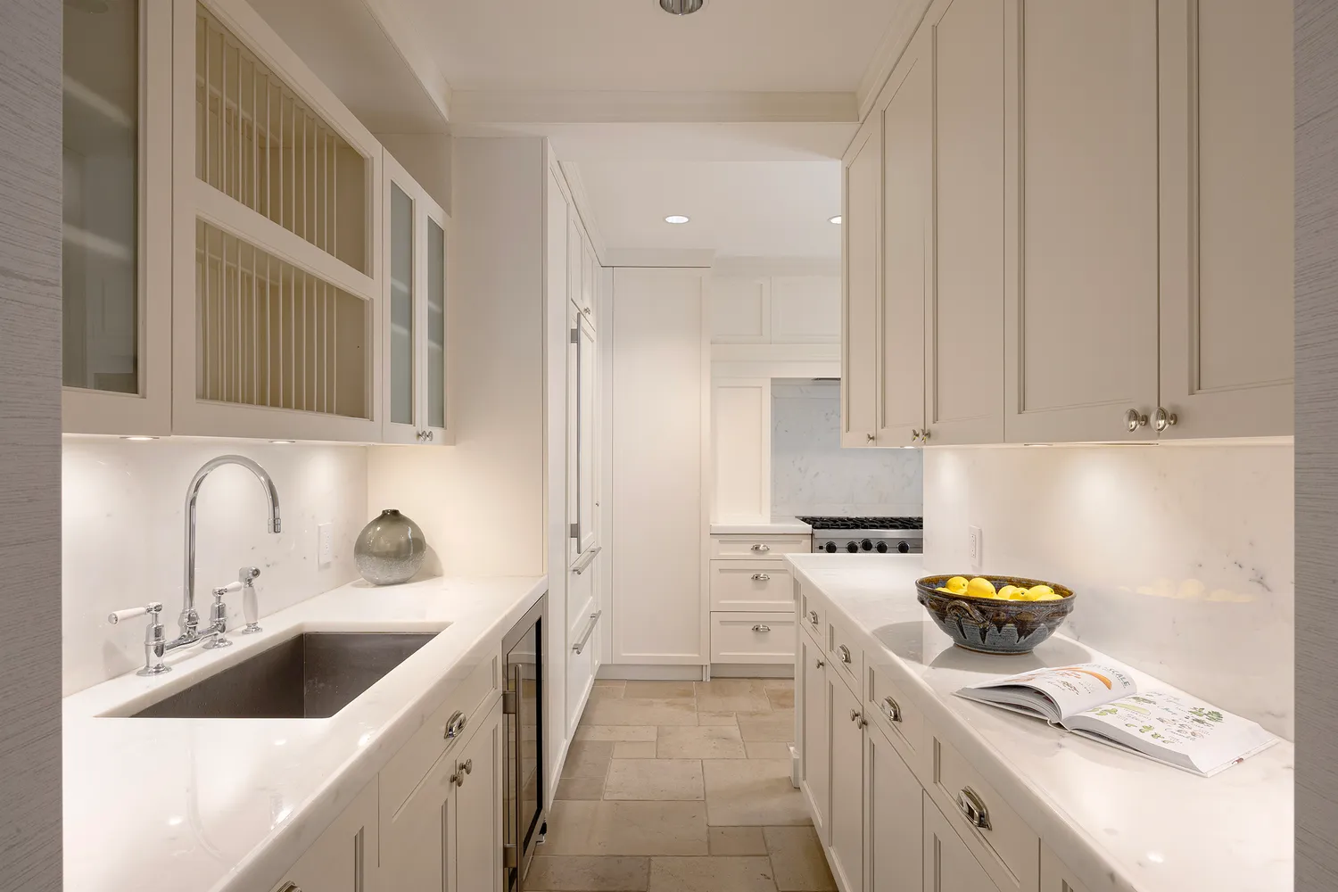 a kitchen with a sink cabinets and appliances