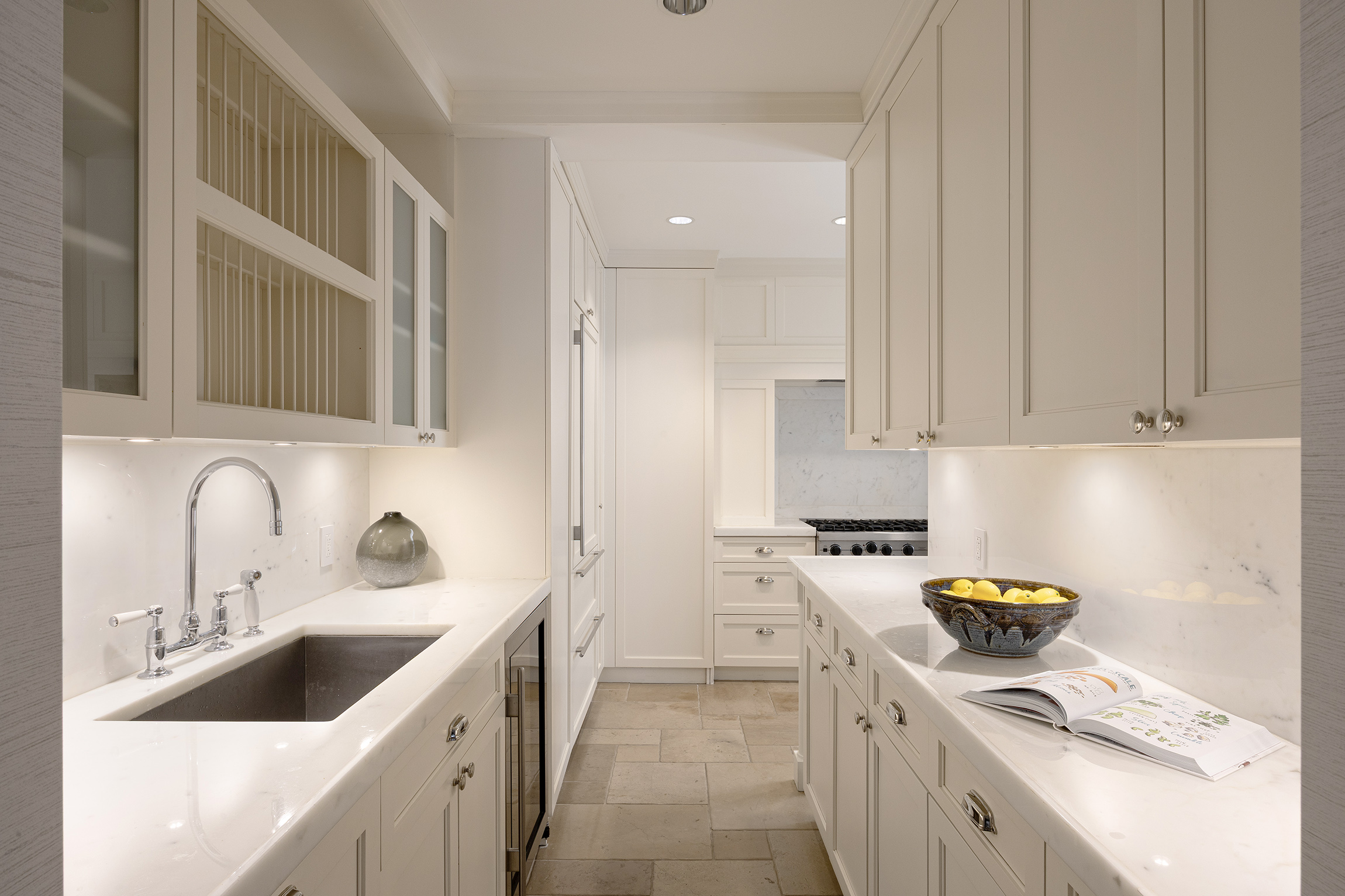 40 East 66th Street, Unit 9A Manhattan, NY 10065 - Photo 6 of 14 a kitchen with a sink cabinets and appliances