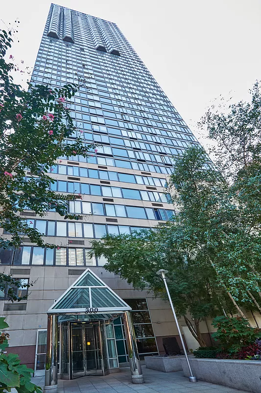 300 East 93rd Street, Unit 14F Manhattan, NY 10128 - Photo 13 of 14 a front view of a house with a yard