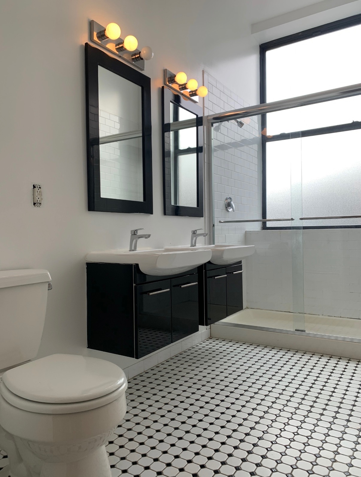 44 Berry Street, Unit 6F Brooklyn, NY 11249 - Photo 6 of 8 a bathroom with a sink vanity granite toilet and a mirror