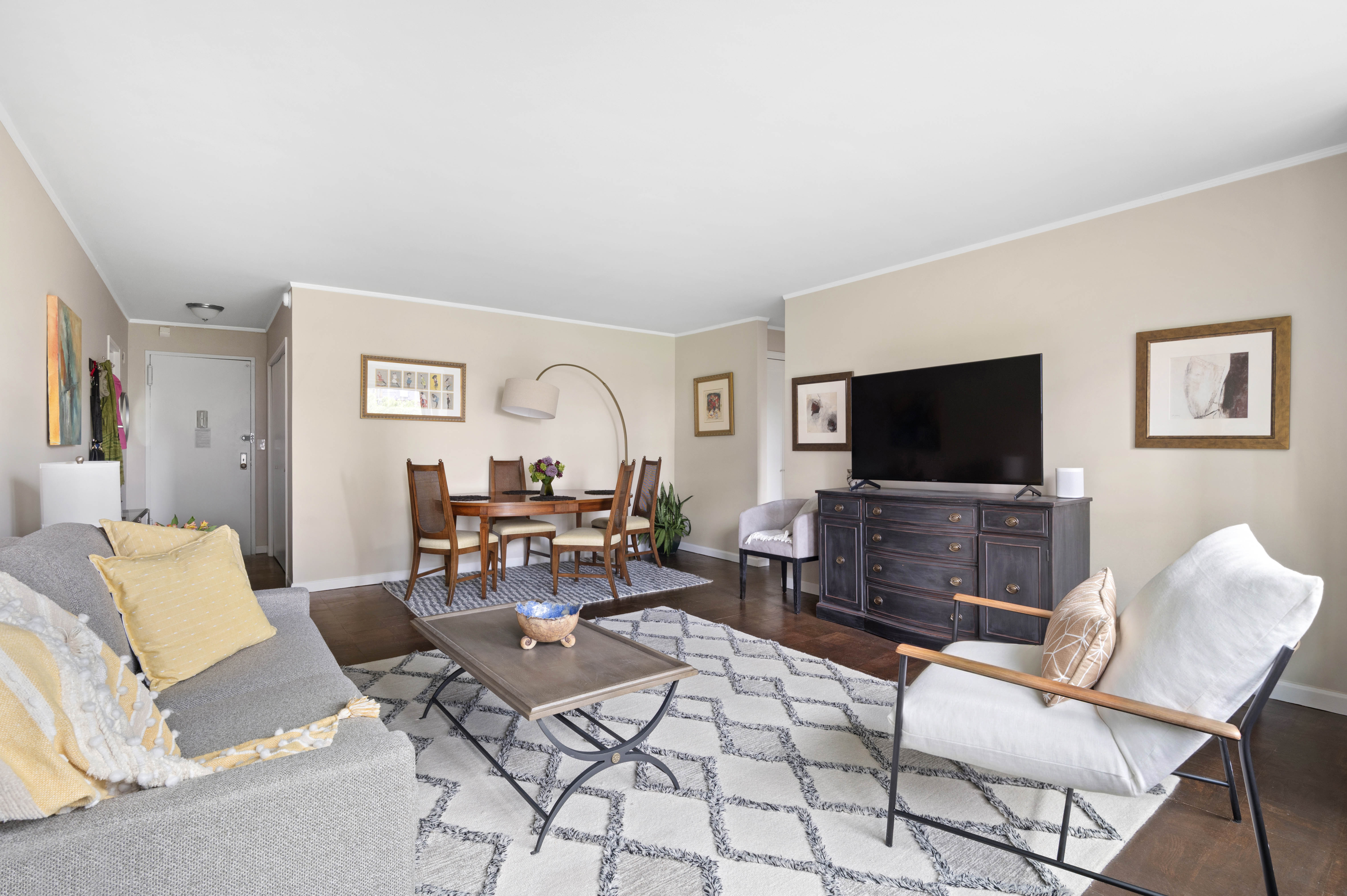 165 West End Avenue, Unit 5A Manhattan, NY 10023 - Photo 3 of 17 a living room with furniture and a flat screen tv